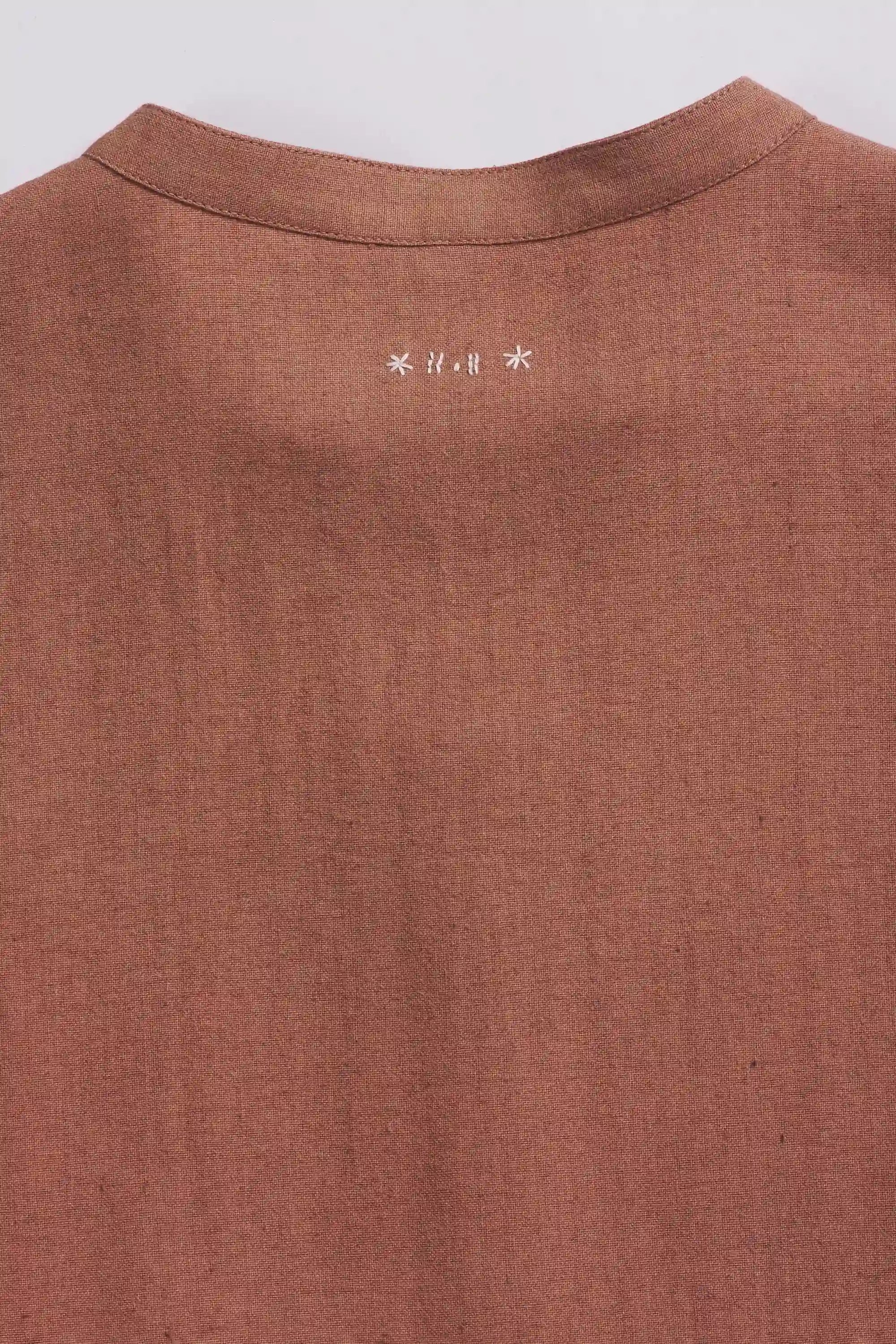 Close-up of fabric with hand detailing