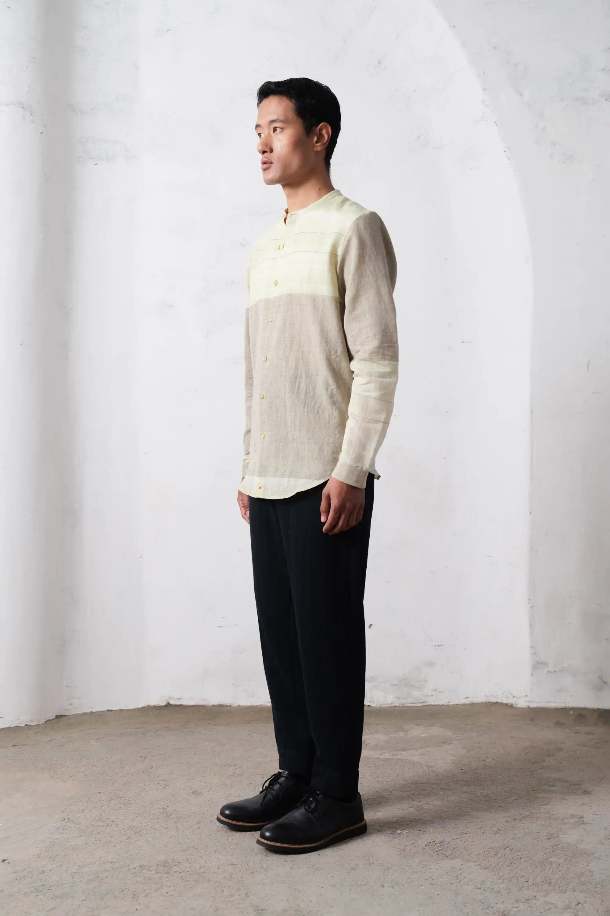 A man wearing khaki green shirt