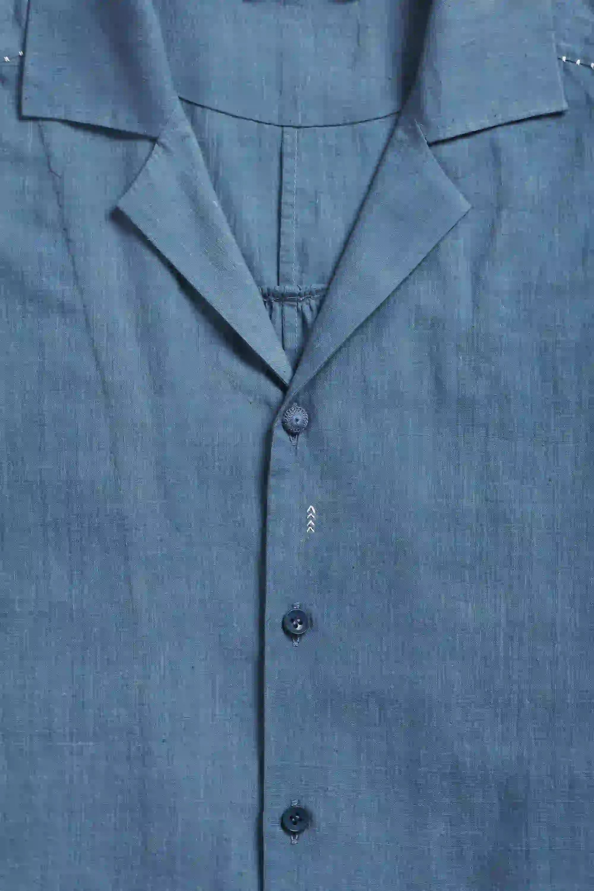 Fabric close-up with button and collar