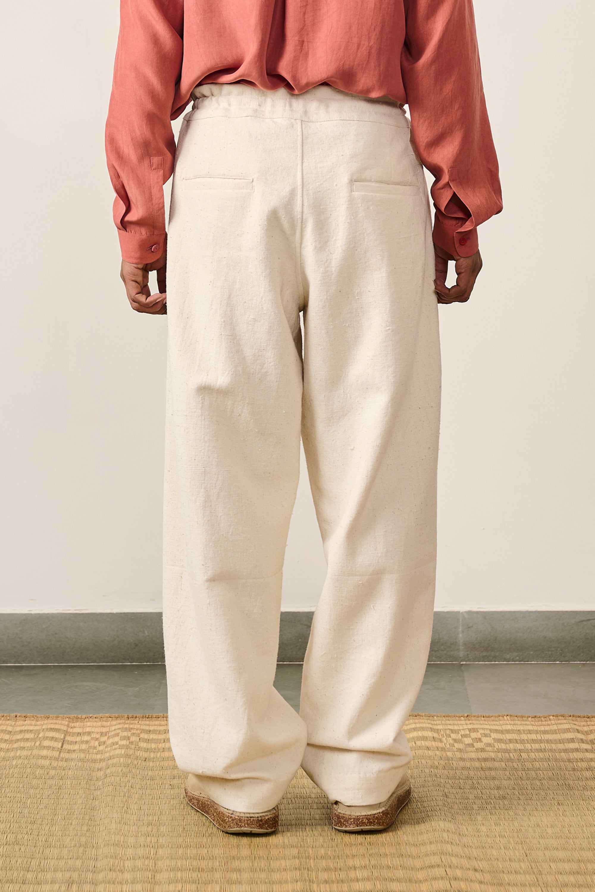 A man wearing ecru trouser