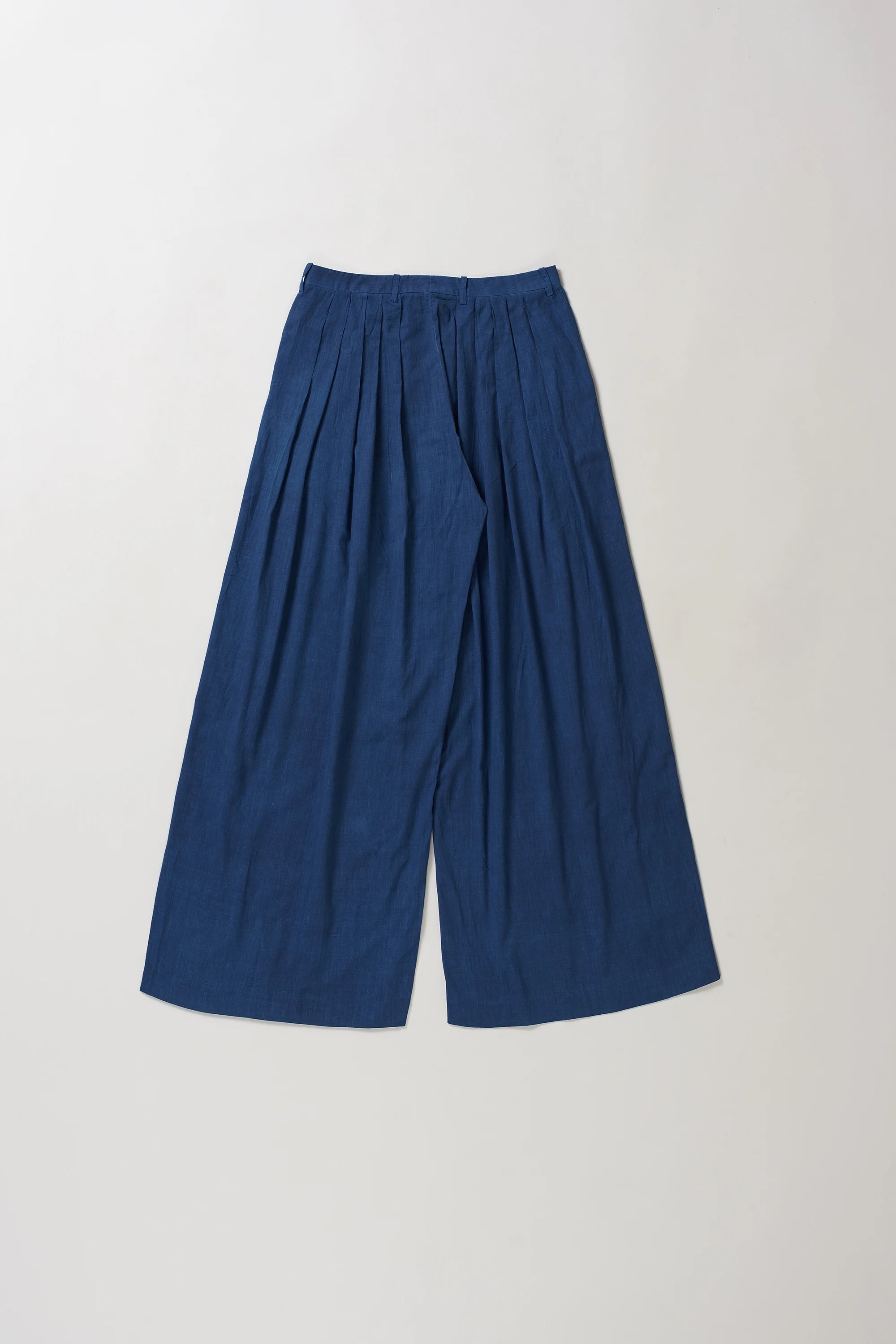 Blue wide-leg pants on a light grey background