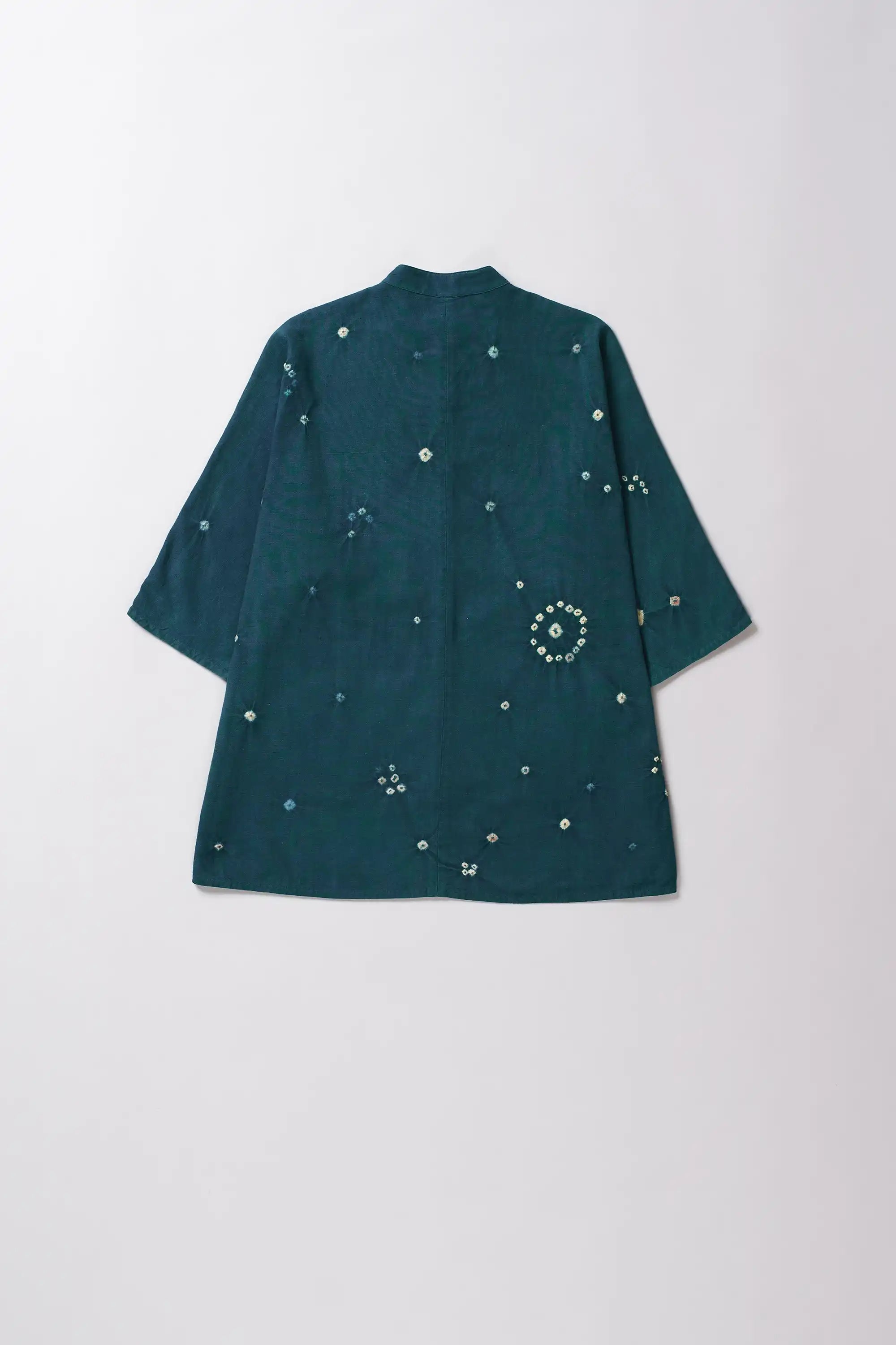 Back shot of a leaf green cotton shirt