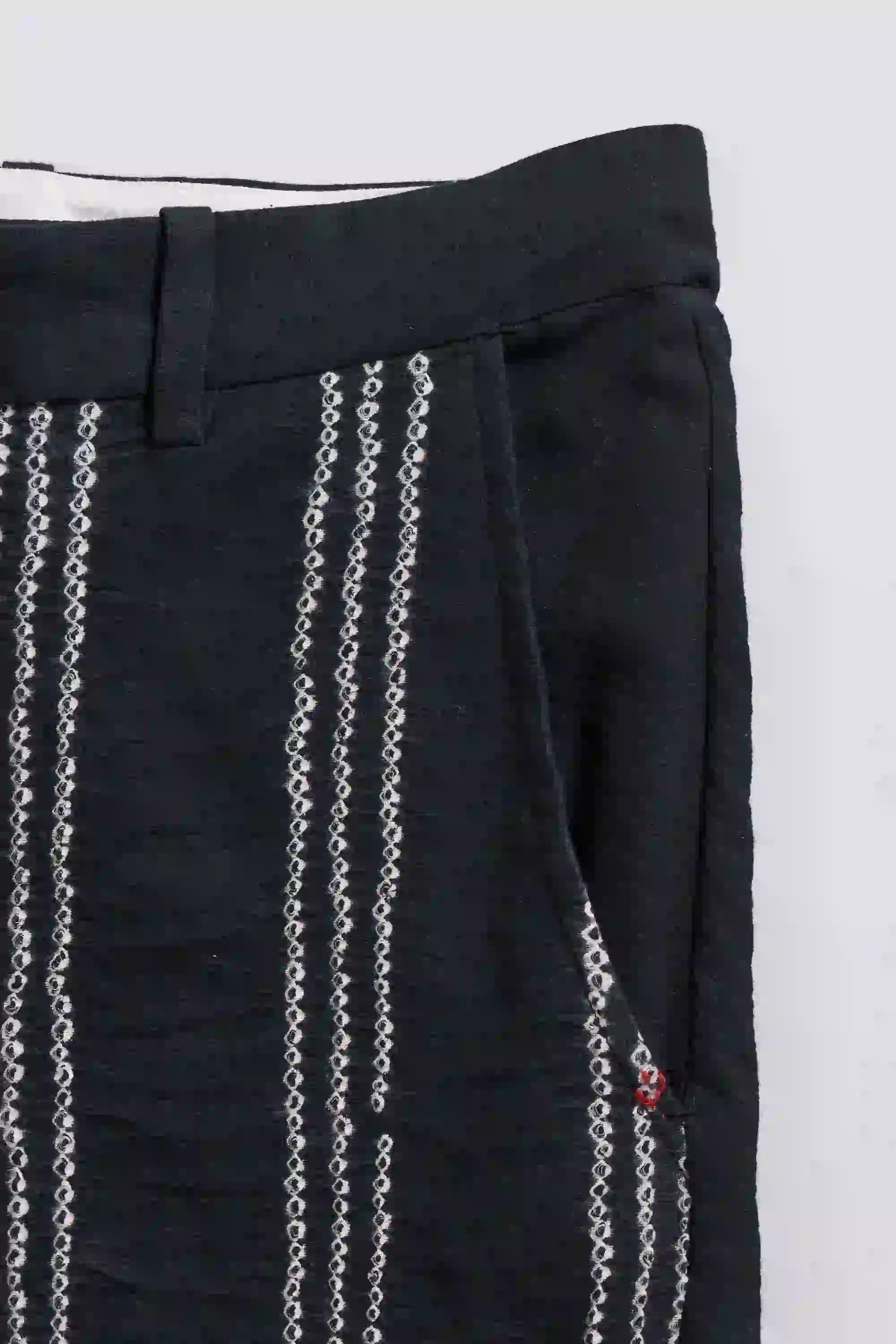 Close-up of black fabric with pocket on a background