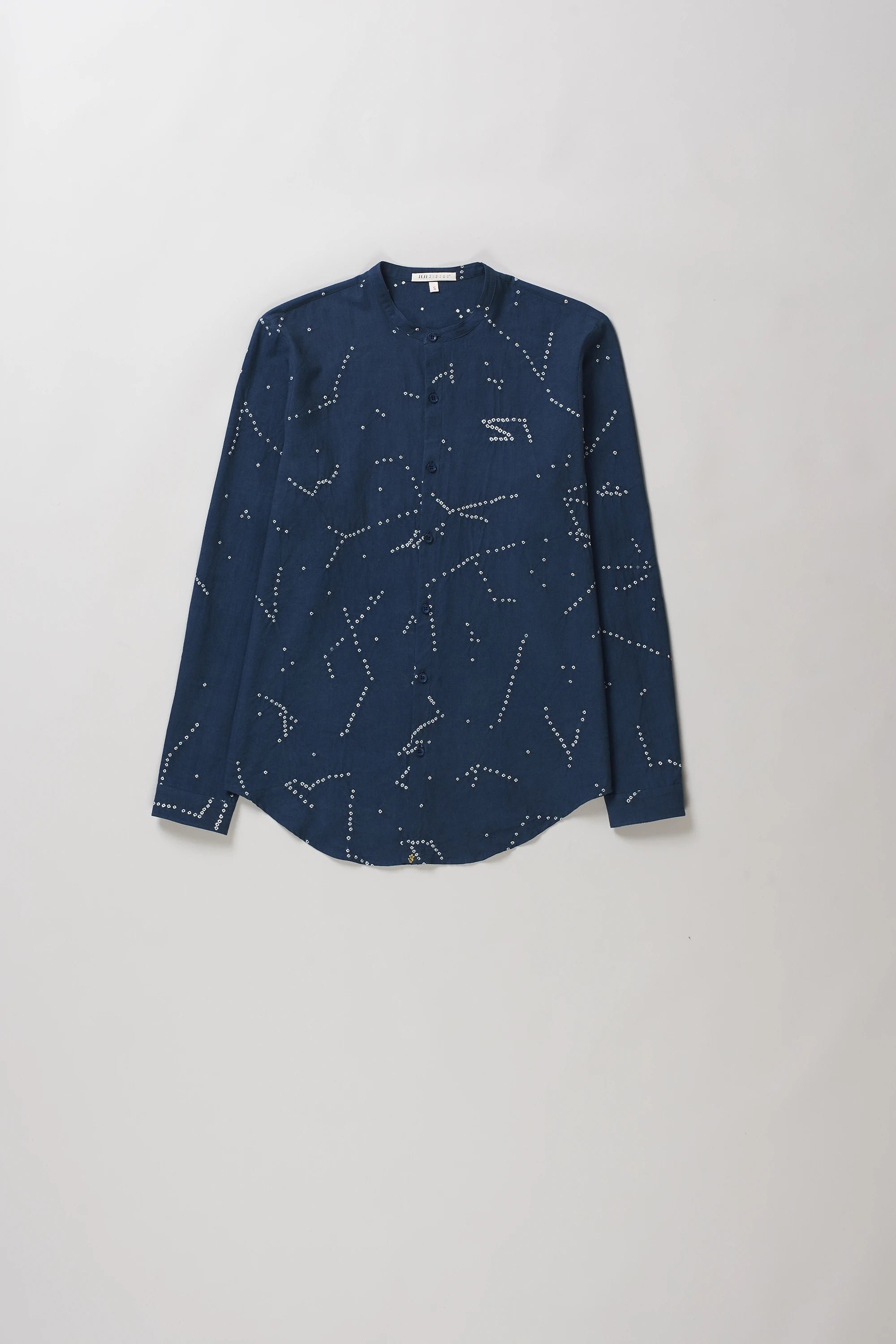 A space blue long-sleeve button-up shirt with an all-over white dotted constellation pattern.