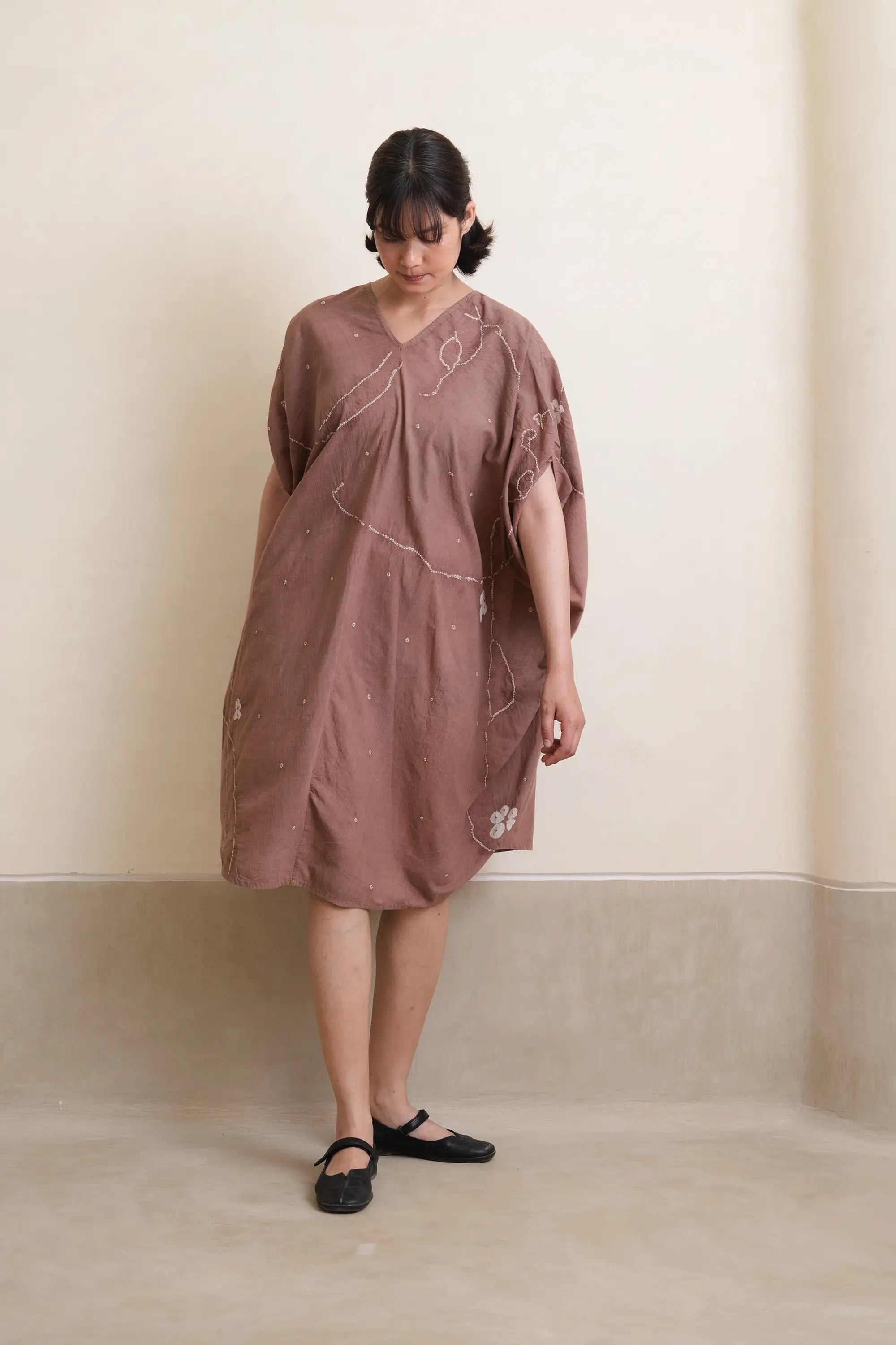 A woman wearing cotton dress