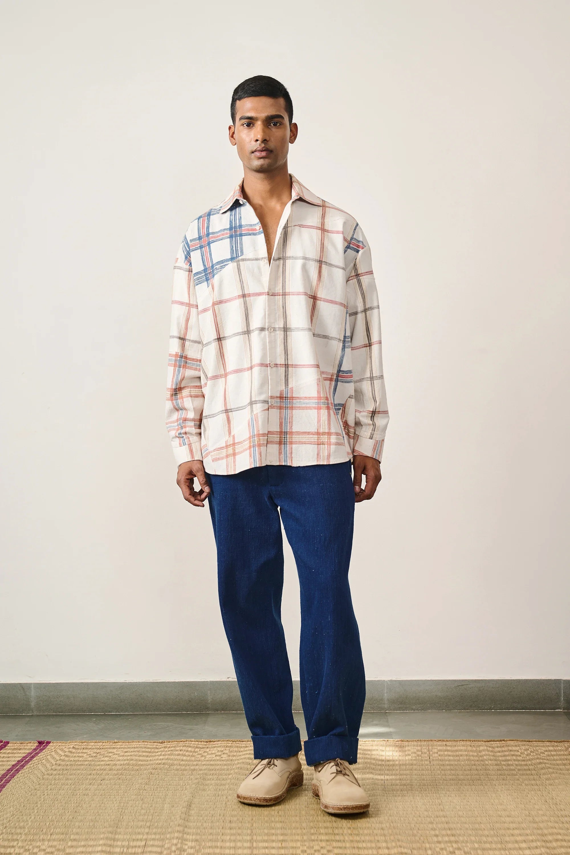 A man wearing multi colour shirt