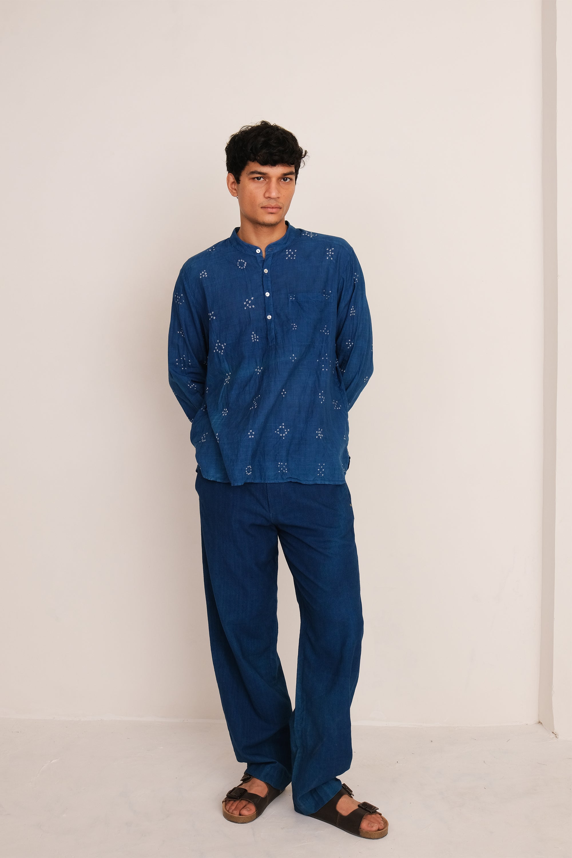 Front shot a man wearing of medium indigo cotton pant