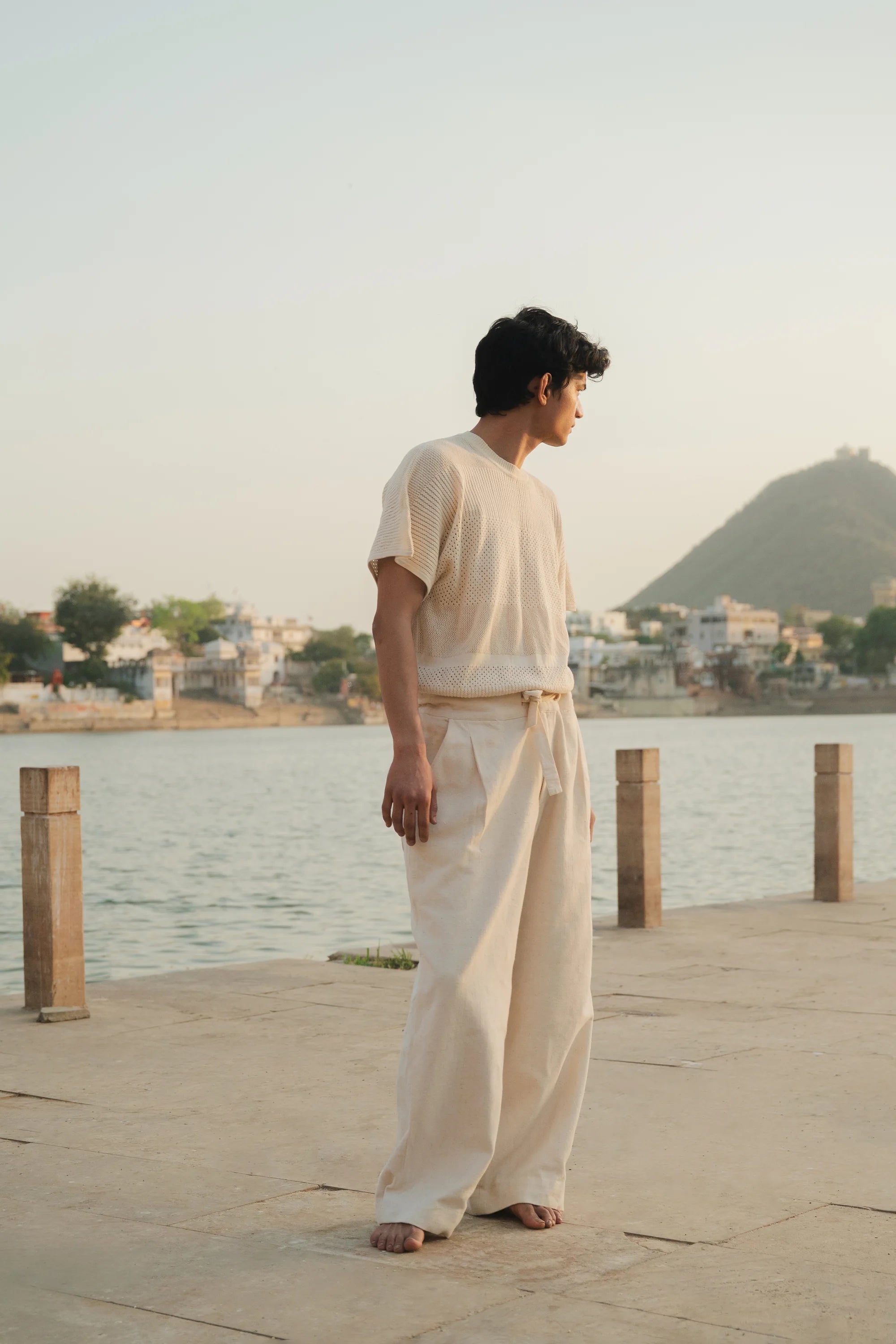 A man wearing ecru cotton pant