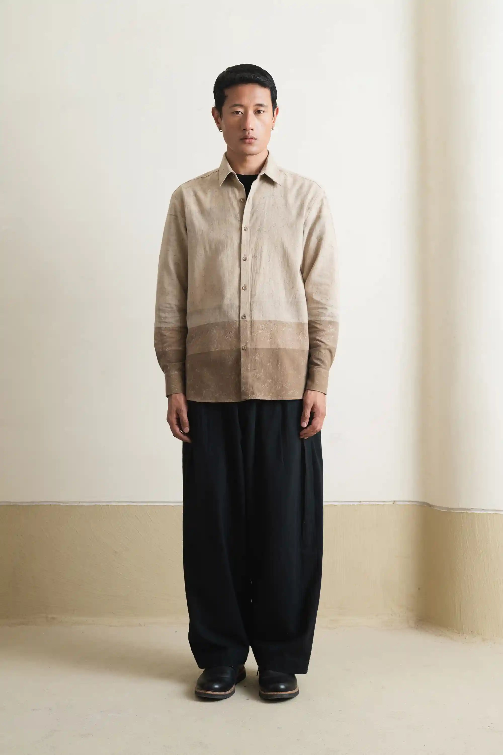 A man wearing smoke cotton shirt with indigo pant