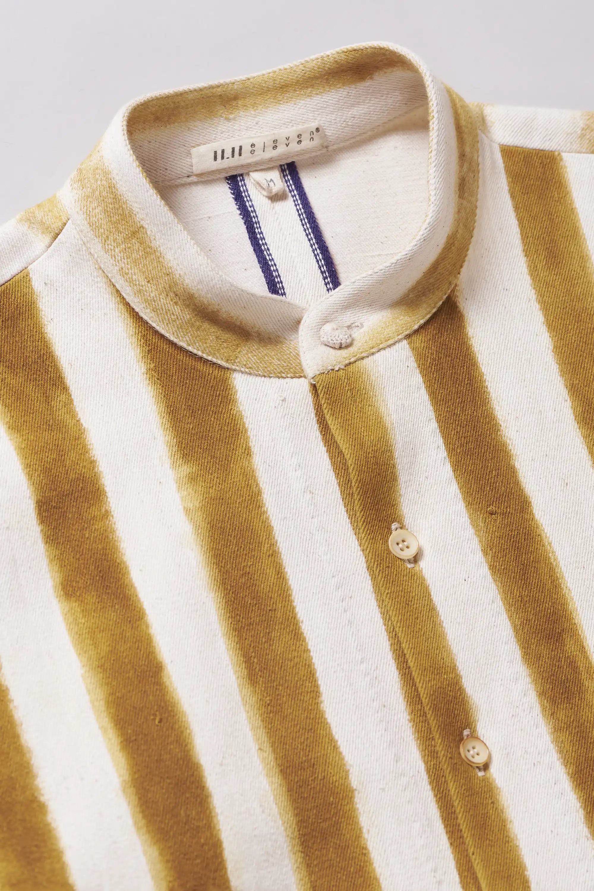 Close-up of band collar and buttons