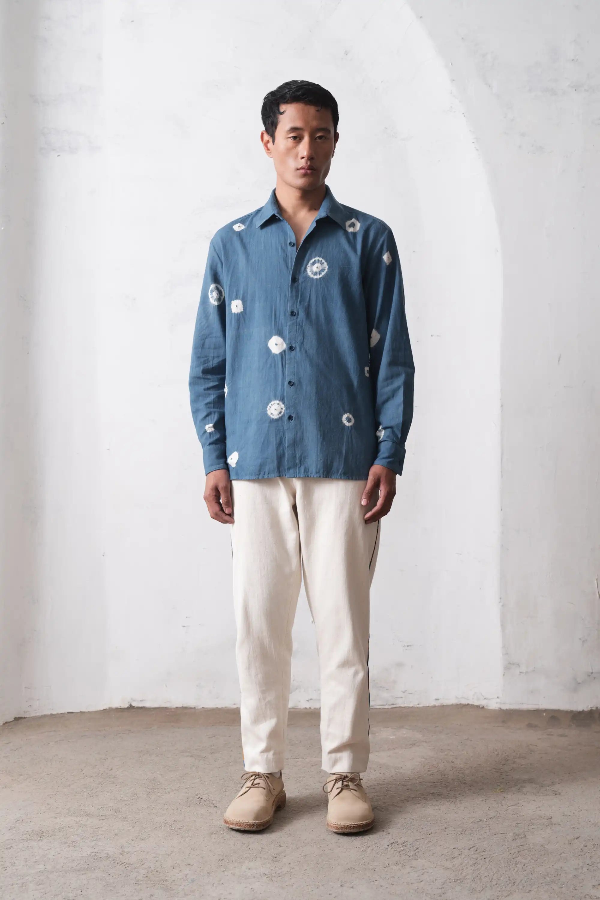 A man wearing powder blue shirt