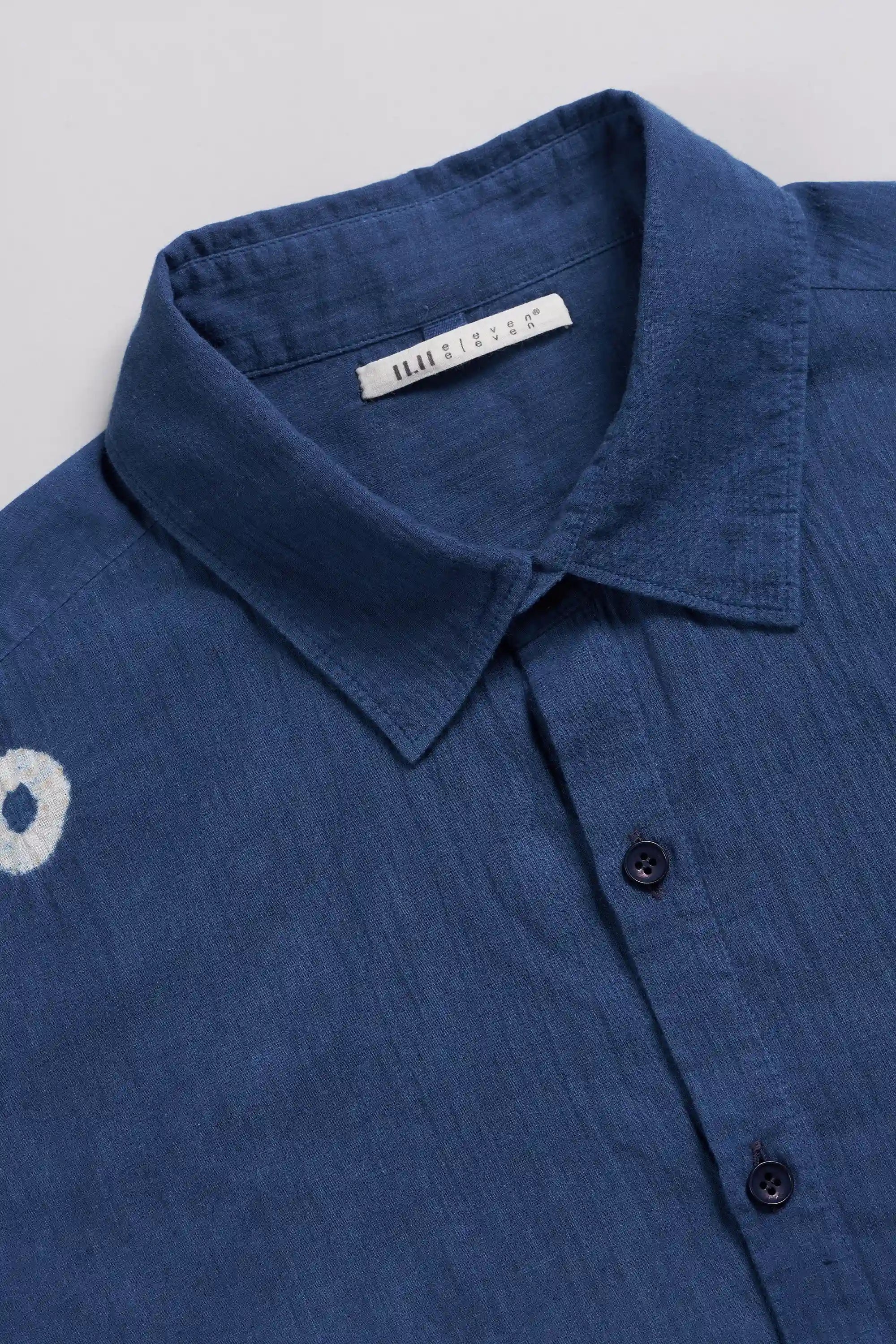 Fabric close-up with band collar and buttons