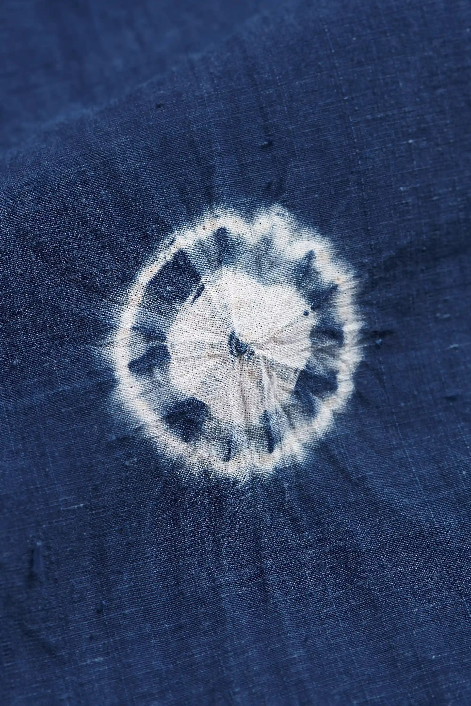 Close-up of a black fabric with shibori.