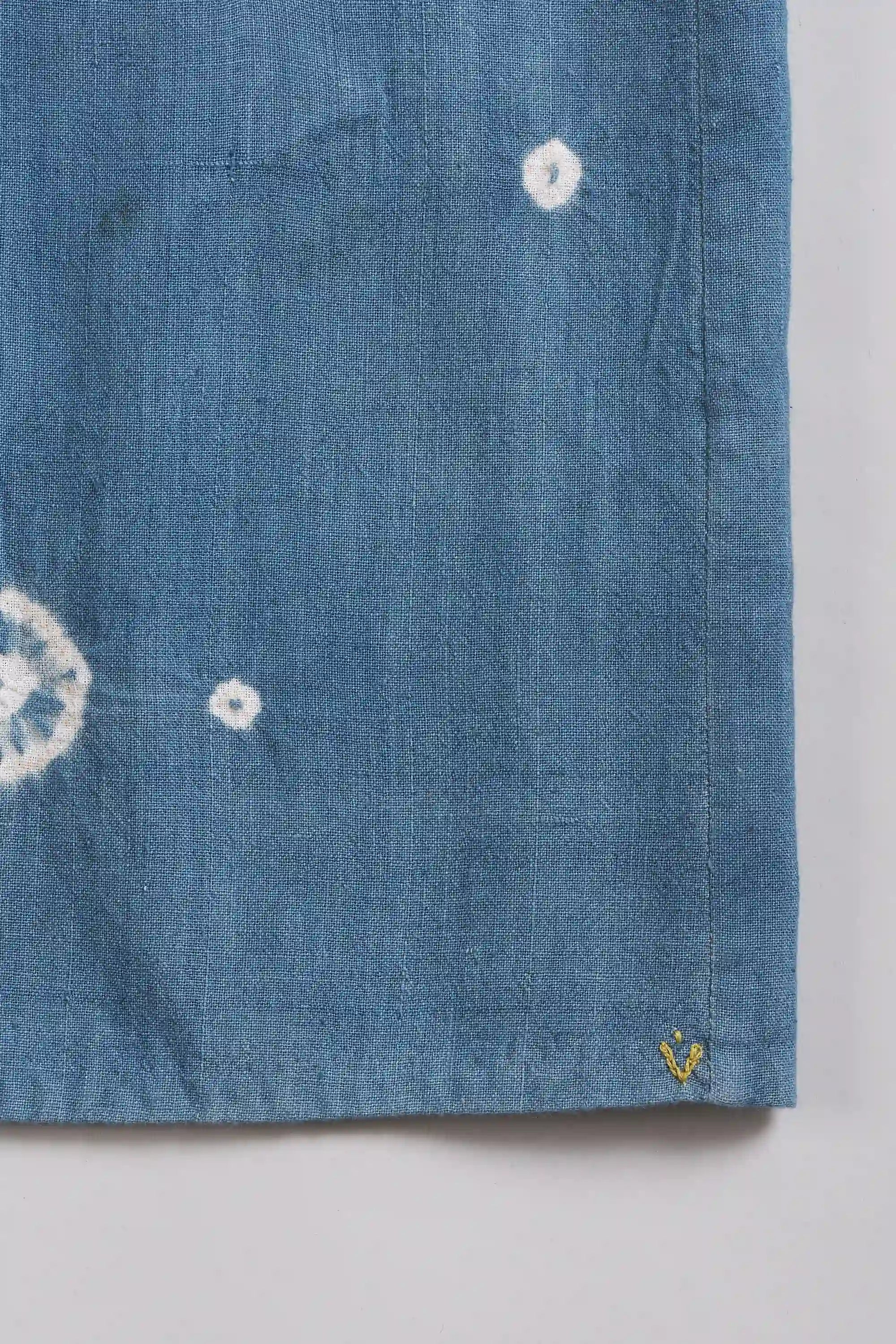 Close-up of fabric with small yellow pehchan