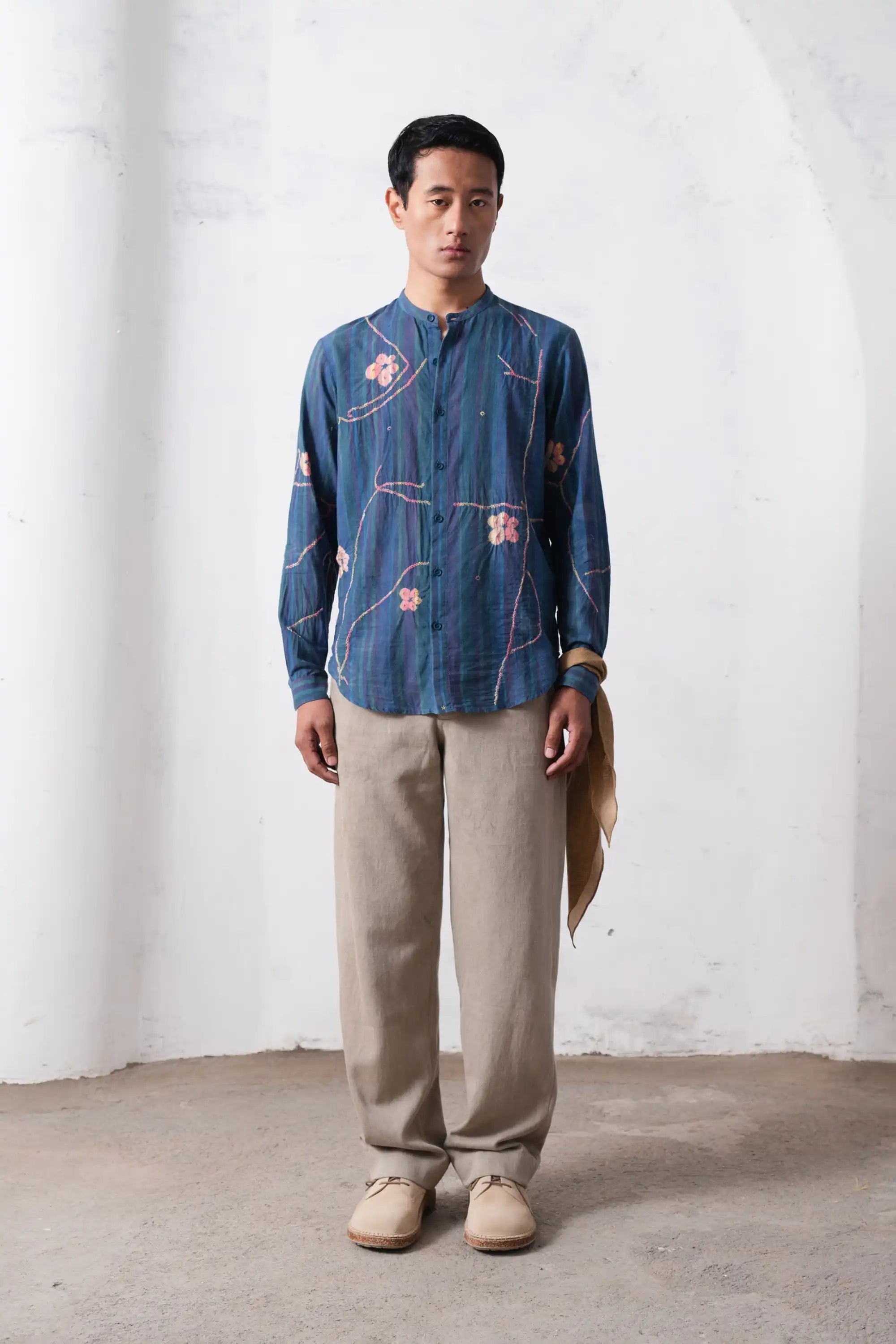 A man wearing sky indigo cotton shirt