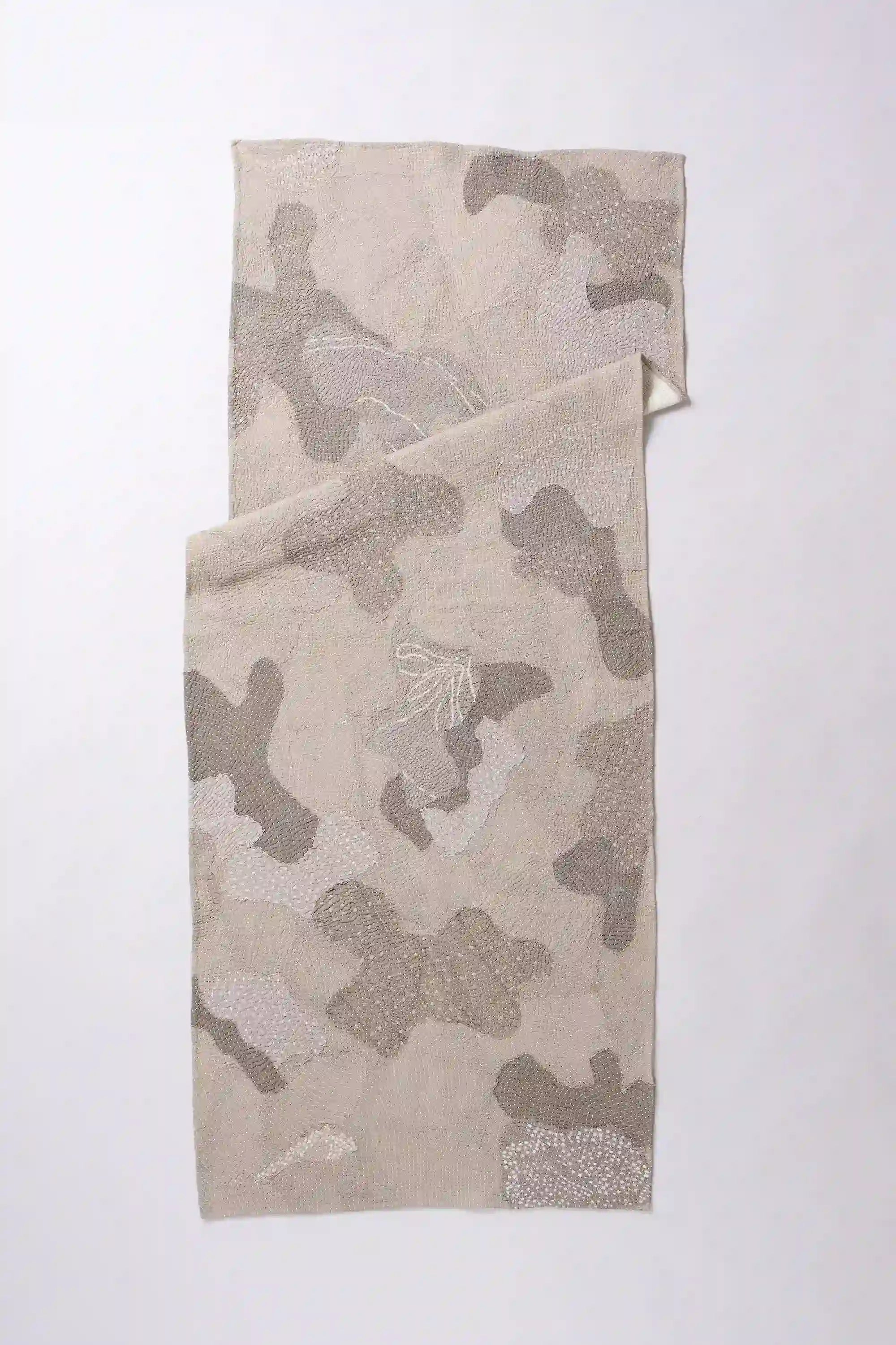 Wine cotton quilt on light grey background