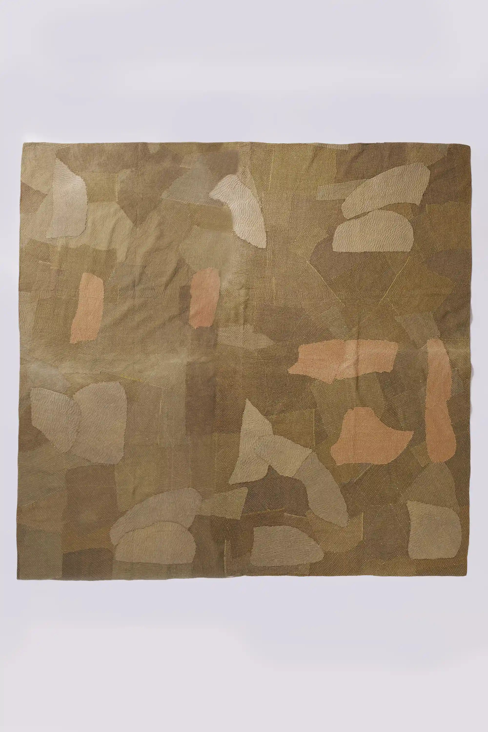 Patchwork quilt in shades of brick red