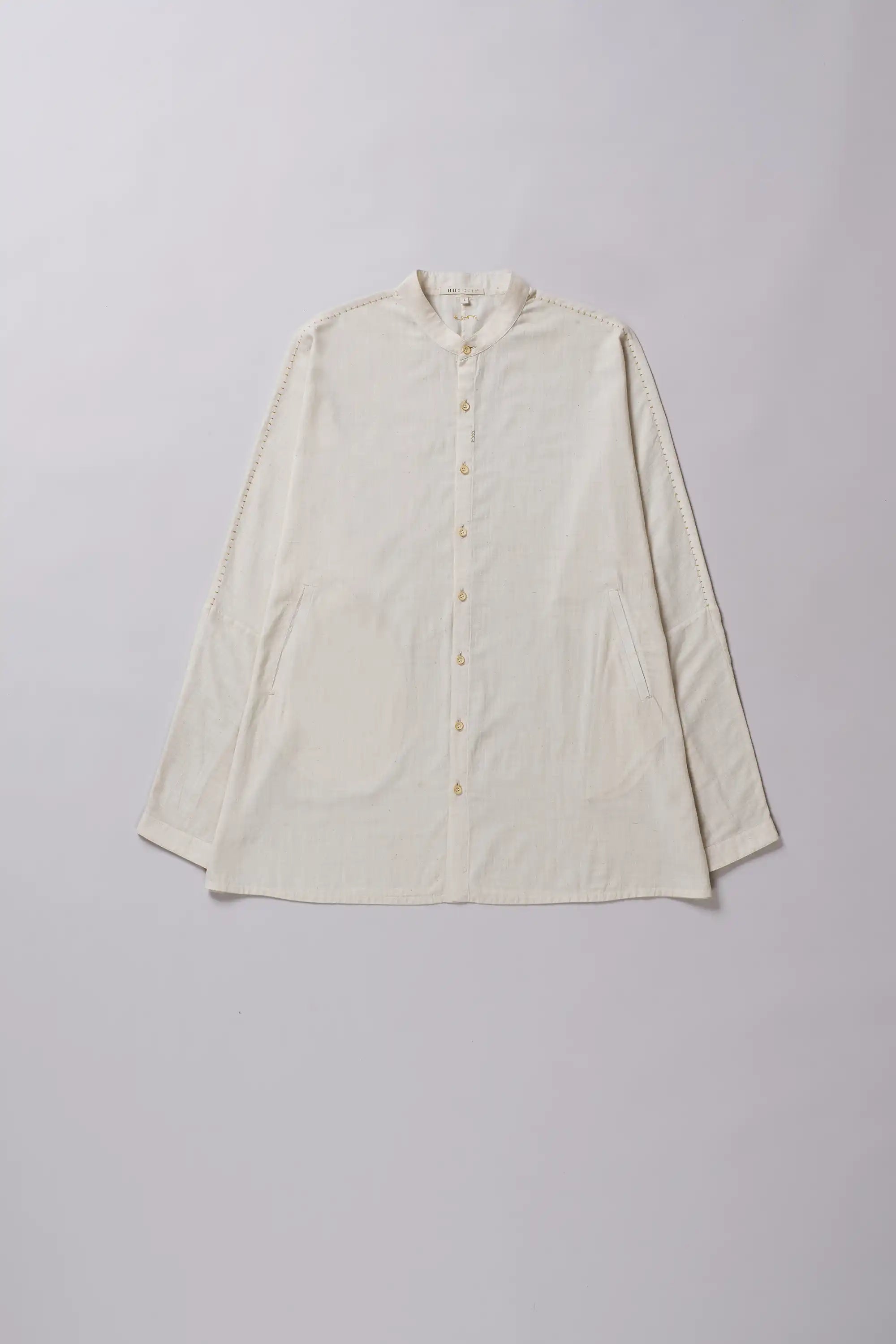 Front image of a ecru shirt with full-sleeves