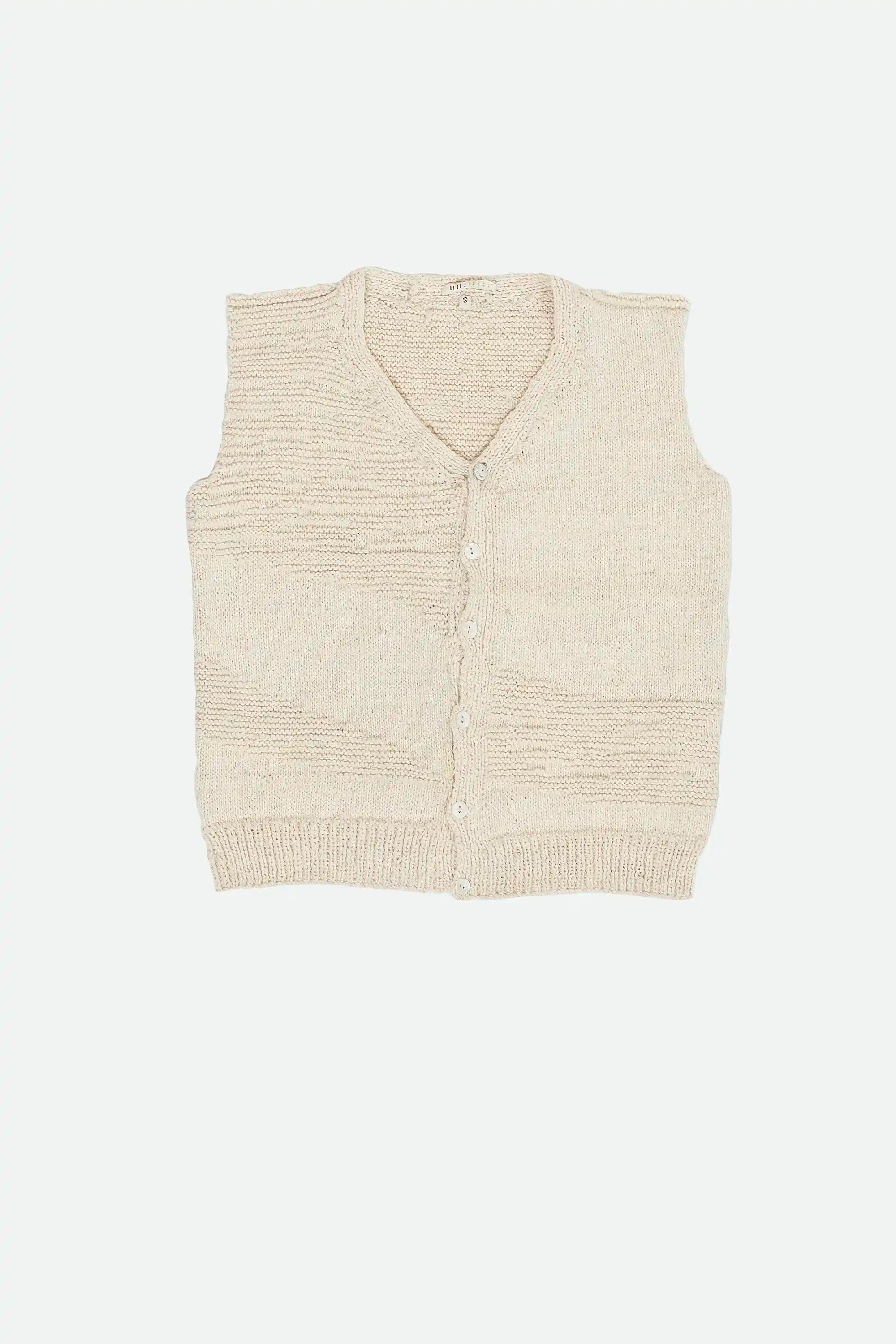 Beige knitted vest on a light grey background