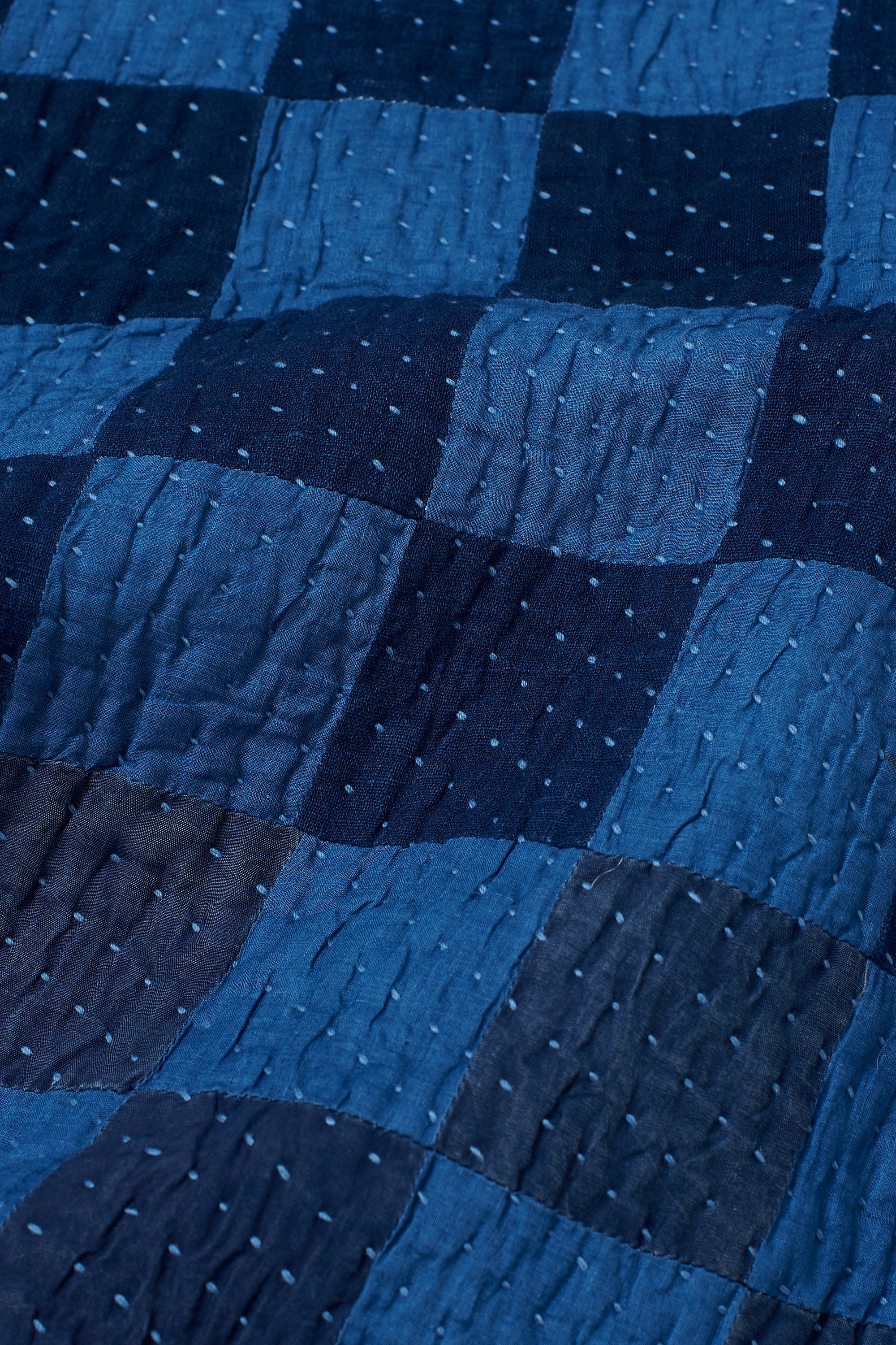 CHEQUERED PATCHWORK CUSHION IN SHADES OF INDIGO