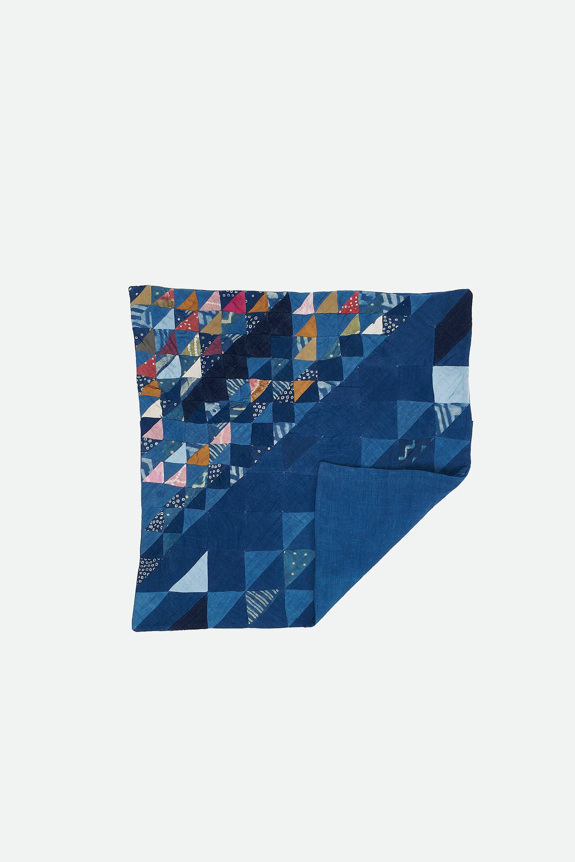 ANGULAR PATCHWORK CUSHION IN SHADES OF INDIGO