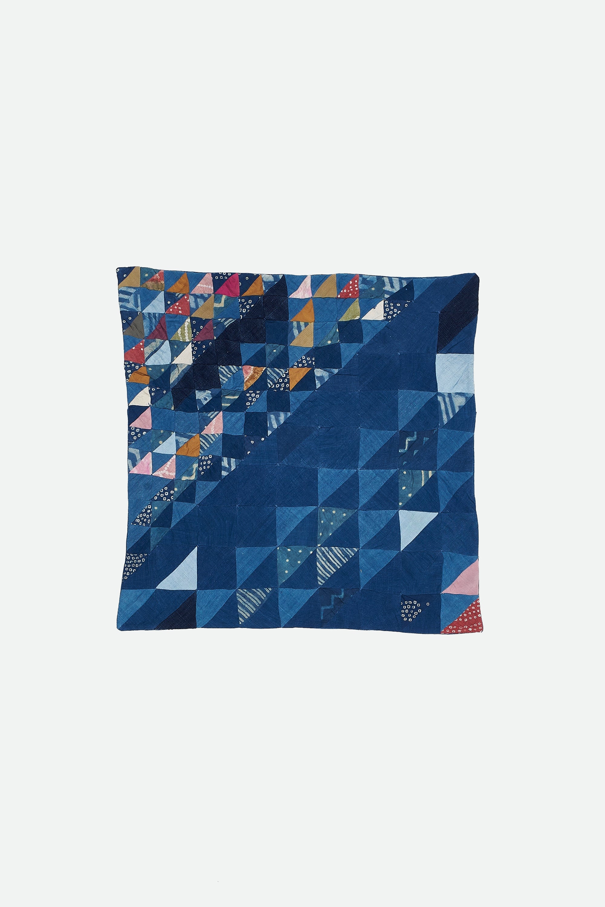 ANGULAR PATCHWORK CUSHION IN SHADES OF INDIGO
