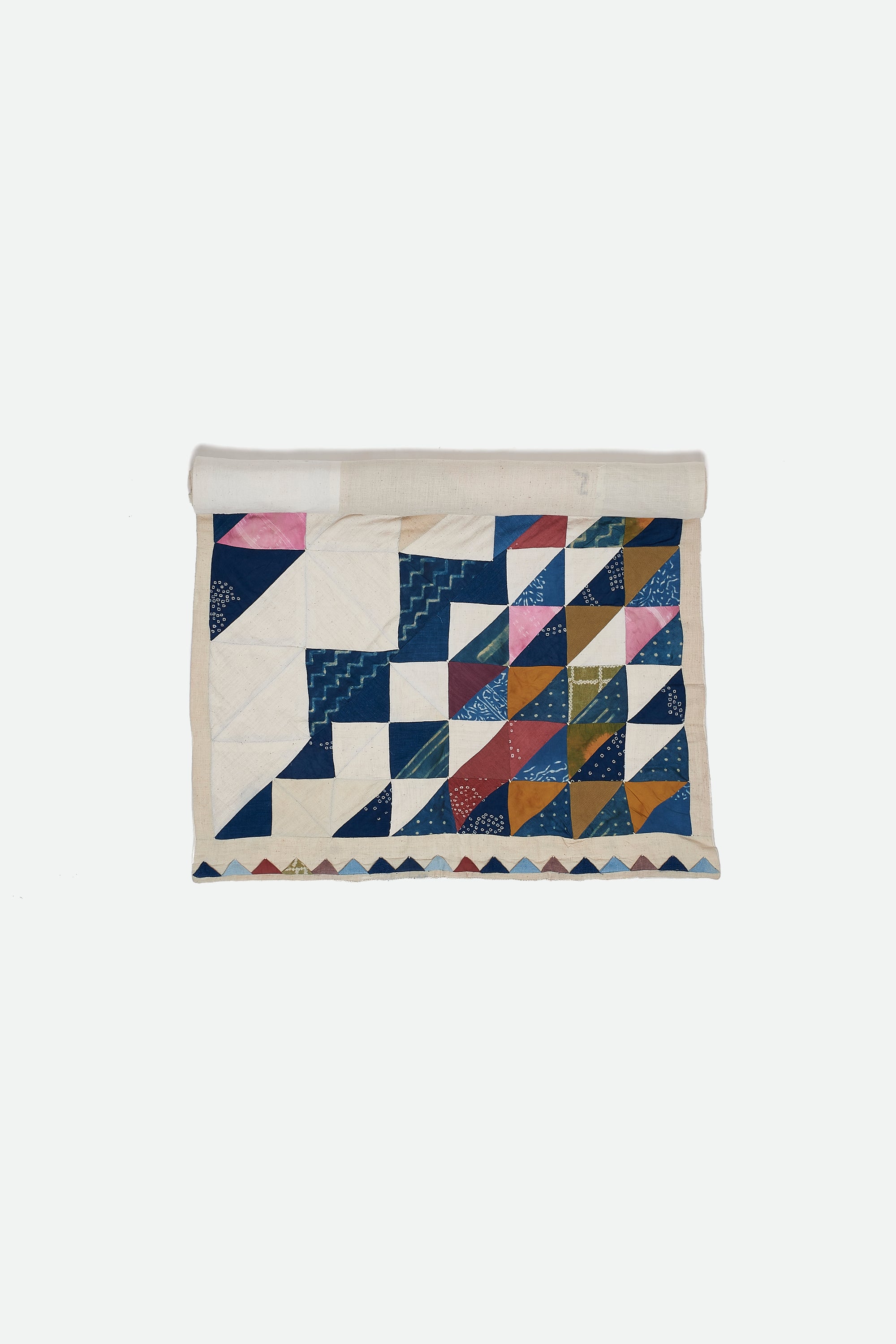 ANGULAR PATCHWORK QUILT IN SHADES OF ECRU AND INDIGO