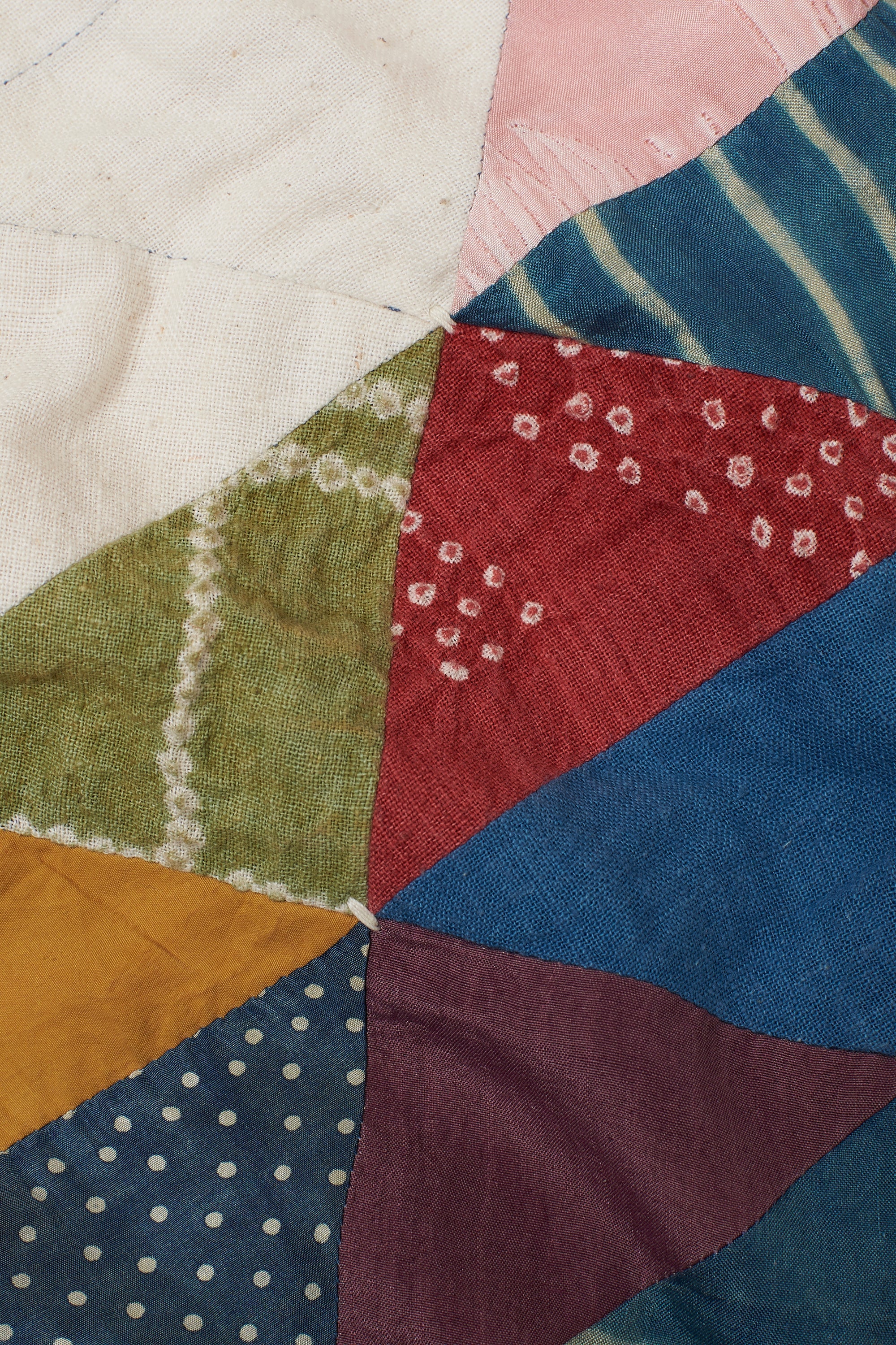 ANGULAR PATCHWORK QUILT IN SHADES OF ECRU AND INDIGO