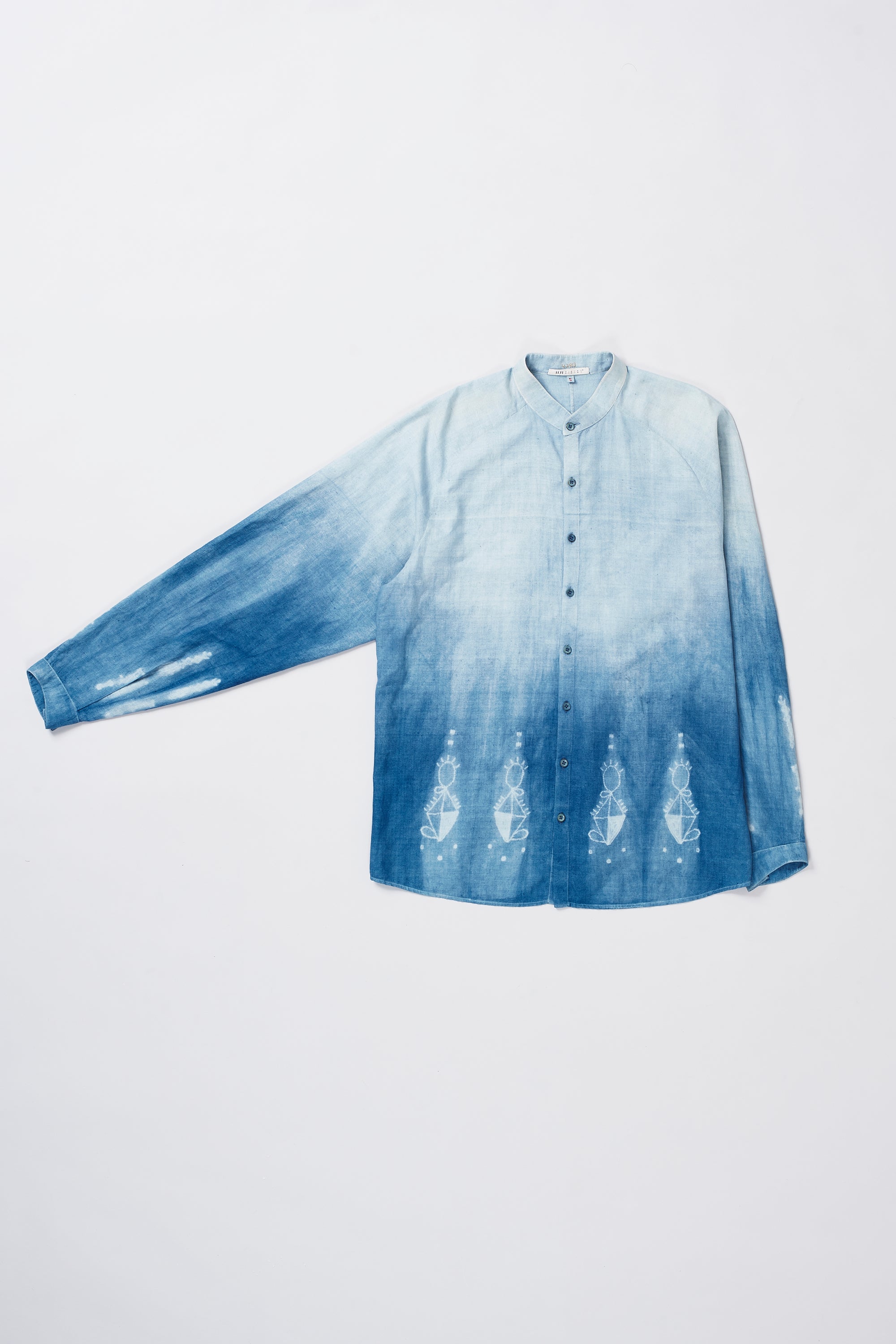 Back image of a medium indigo cotton shibori shirt