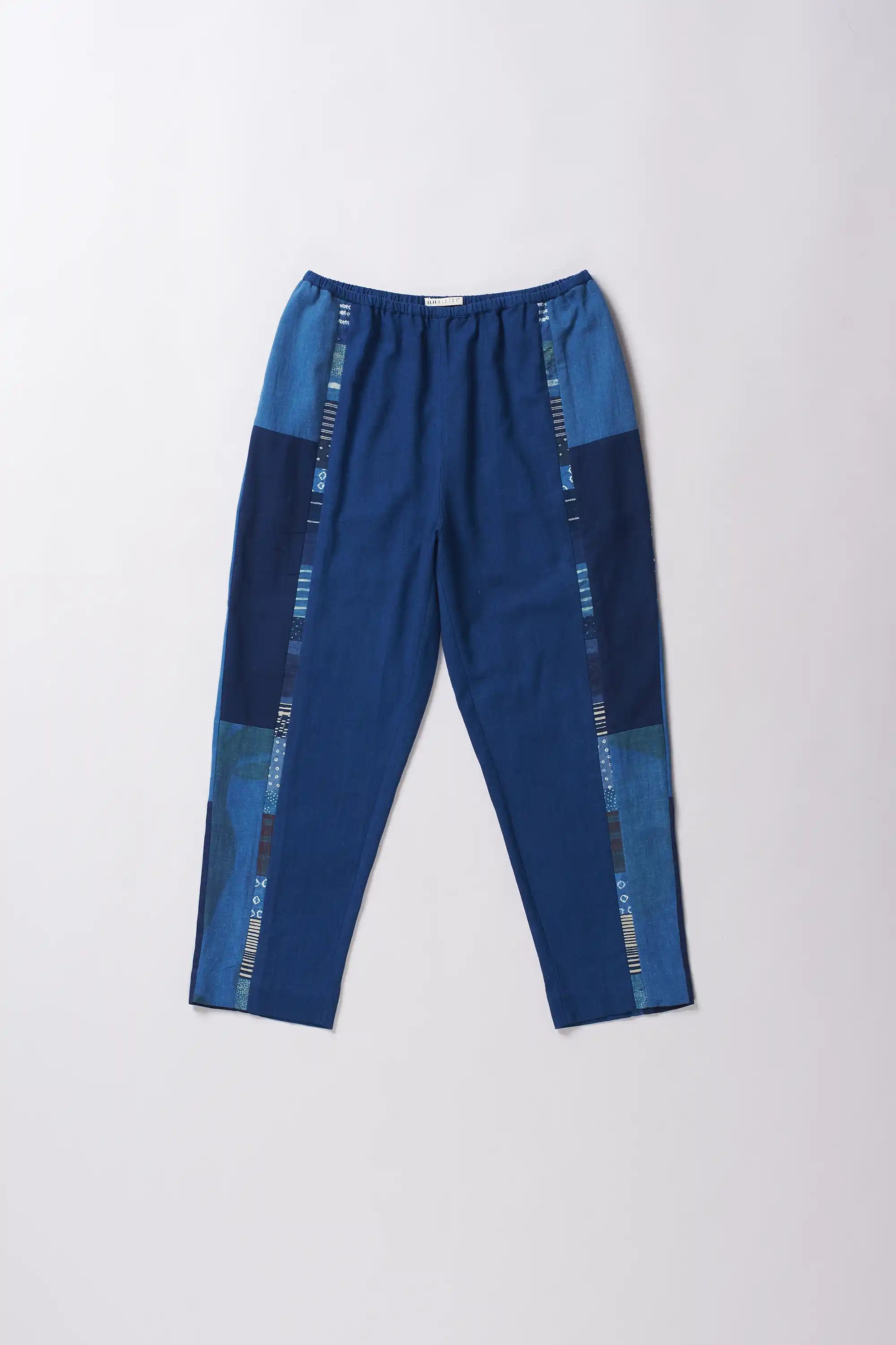Front image of a cotton pant in medium indigo
