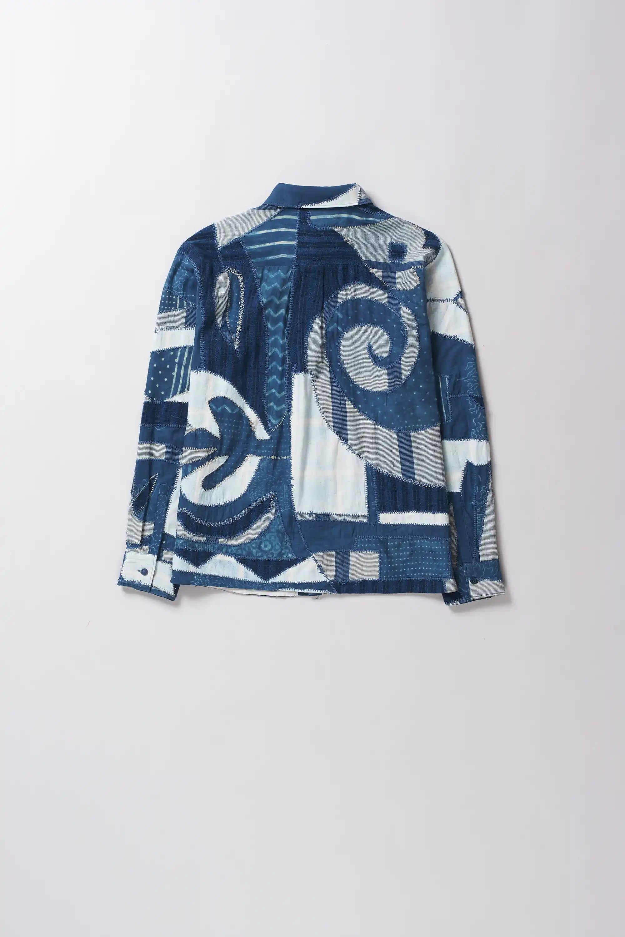 Back shot of shirt with patchwork in shades of indigo