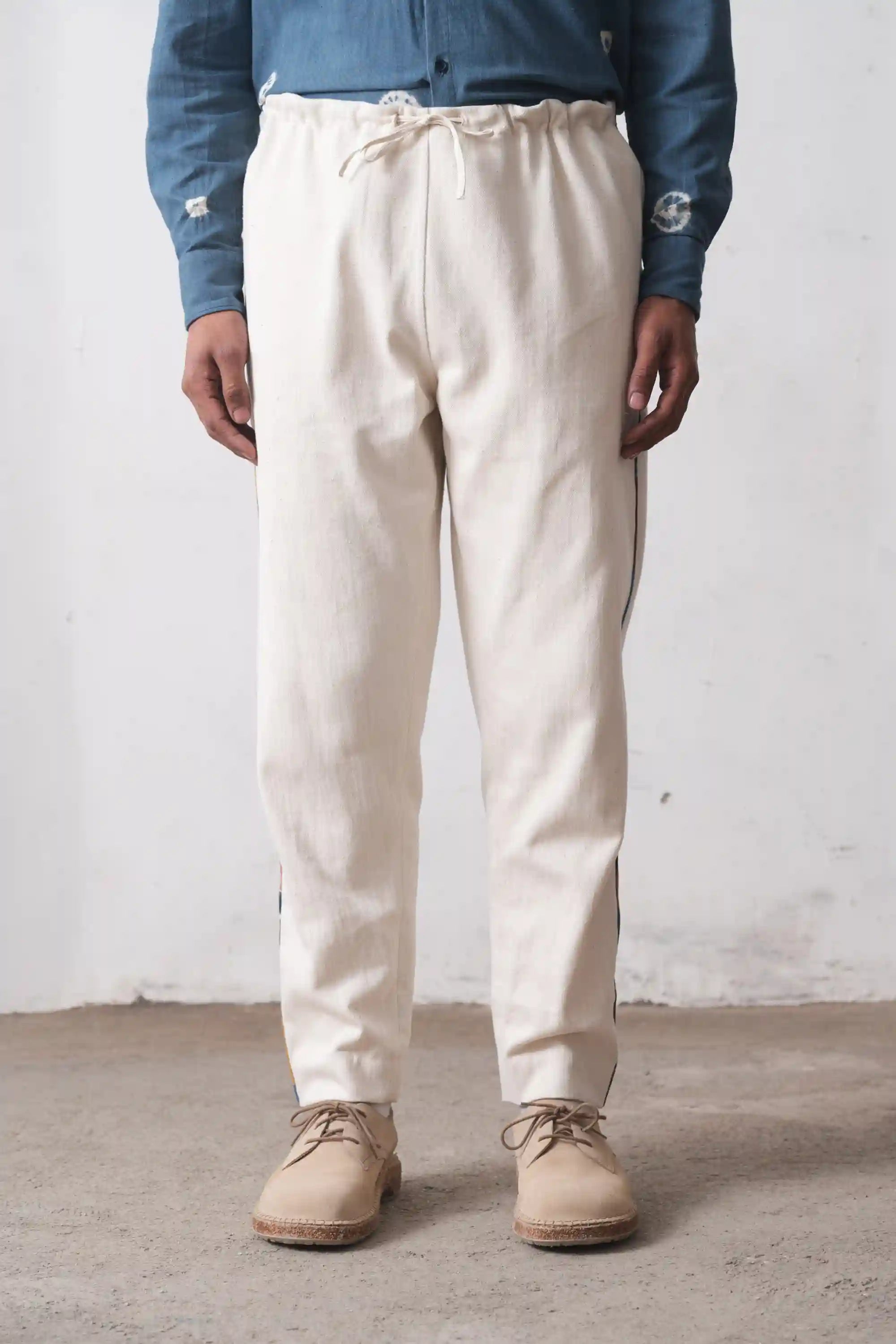 A man wearing ecru trouser