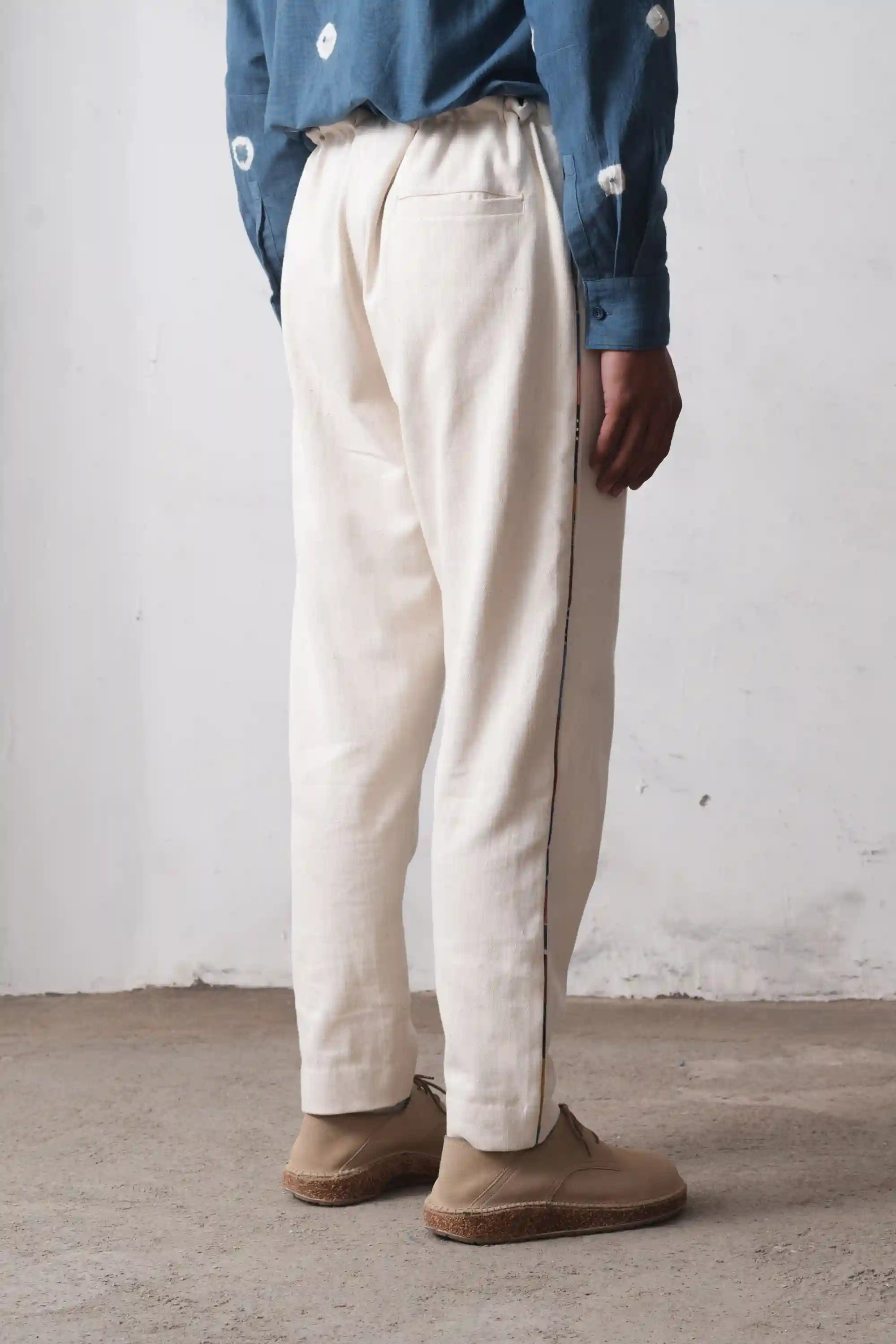A man wearing ecru trouser