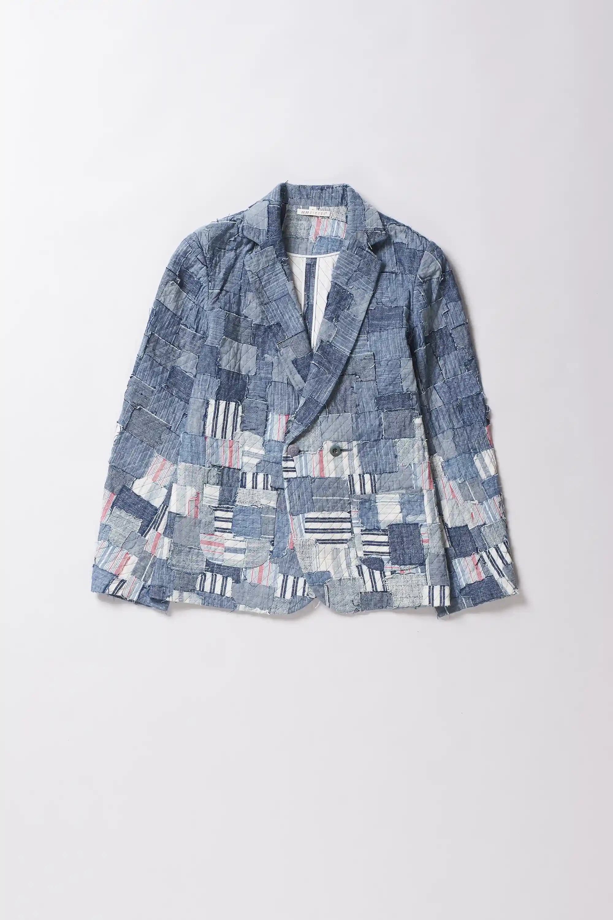 Blue patchwork blazer on a white background