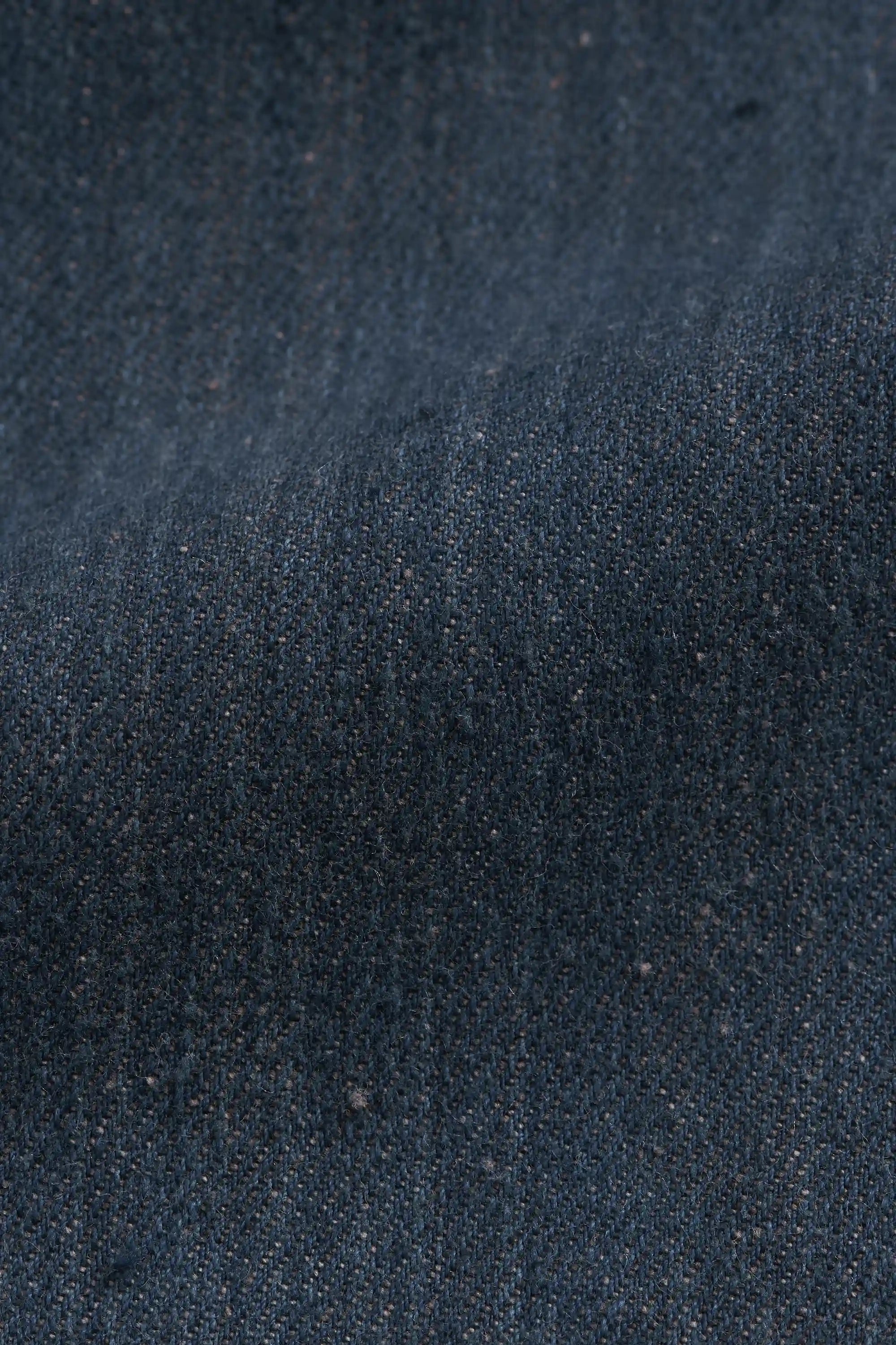 Close-up of dark blue denim fabric