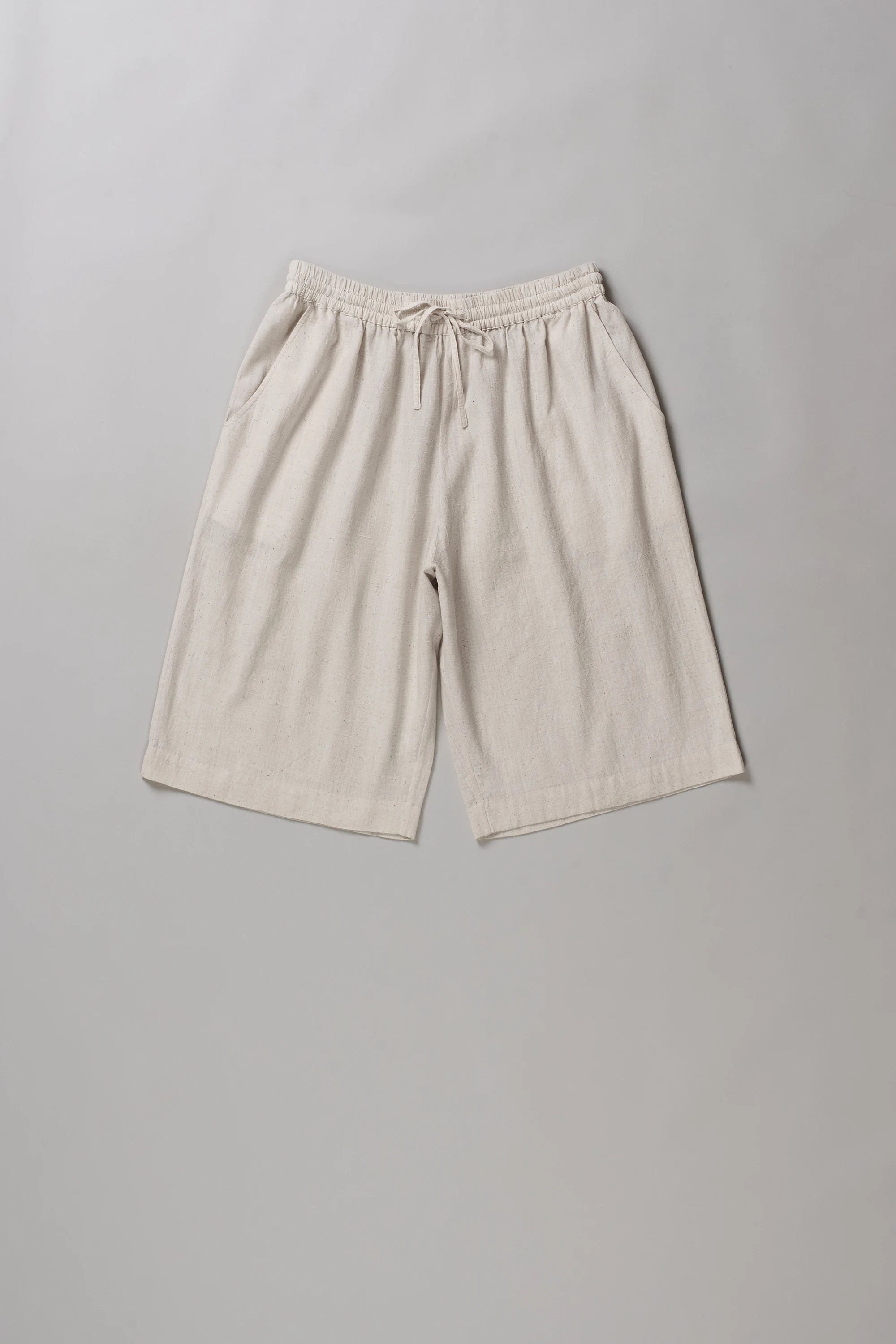 Front image of ecru cotton short