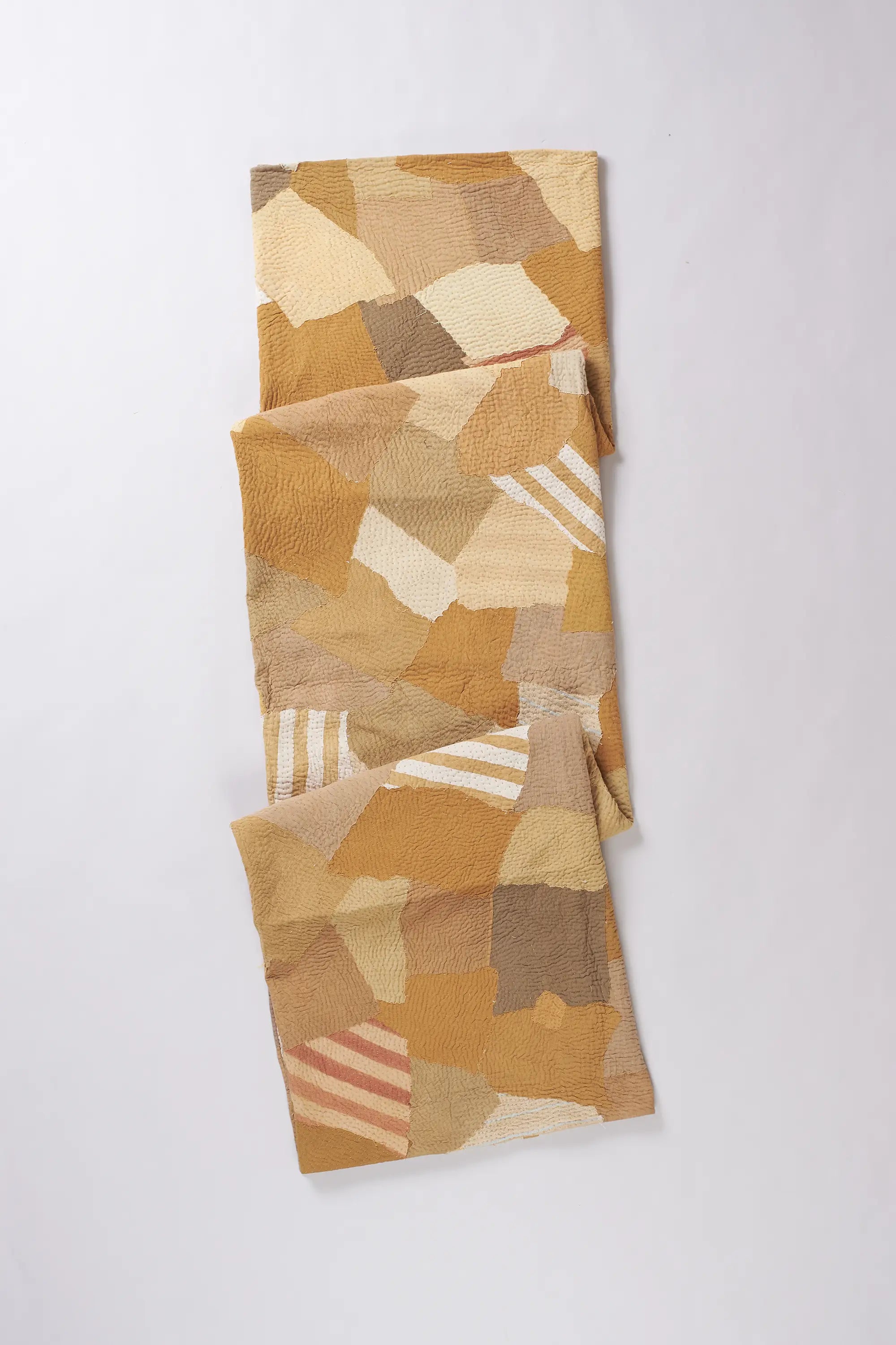 Folded yellow quilt