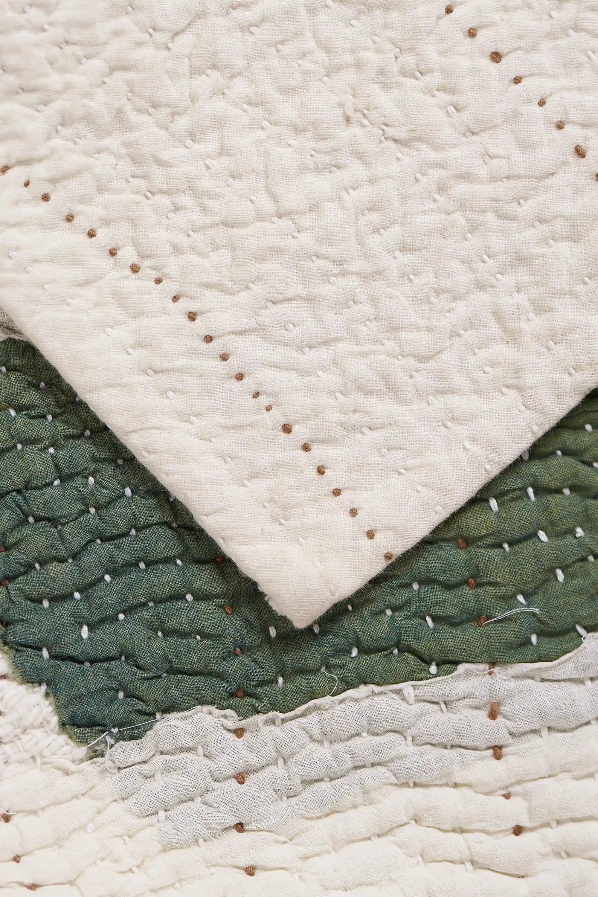 Patchwork quilt in shades of ecru