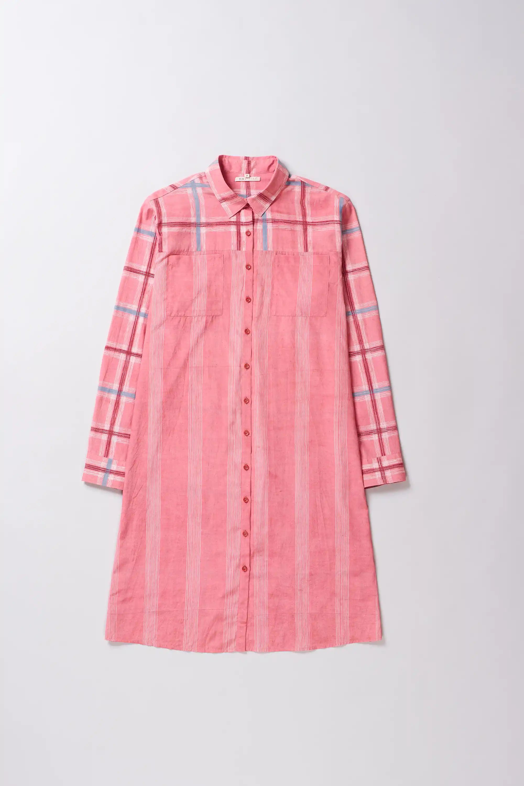 Pink plaid shirt dress on a light gray background