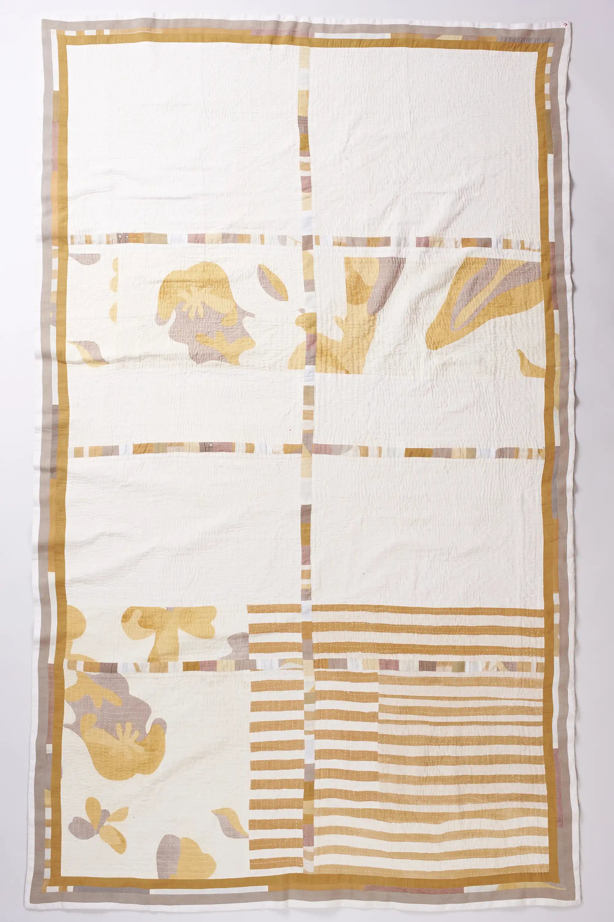 Patchwork quilt in ecru and yellow