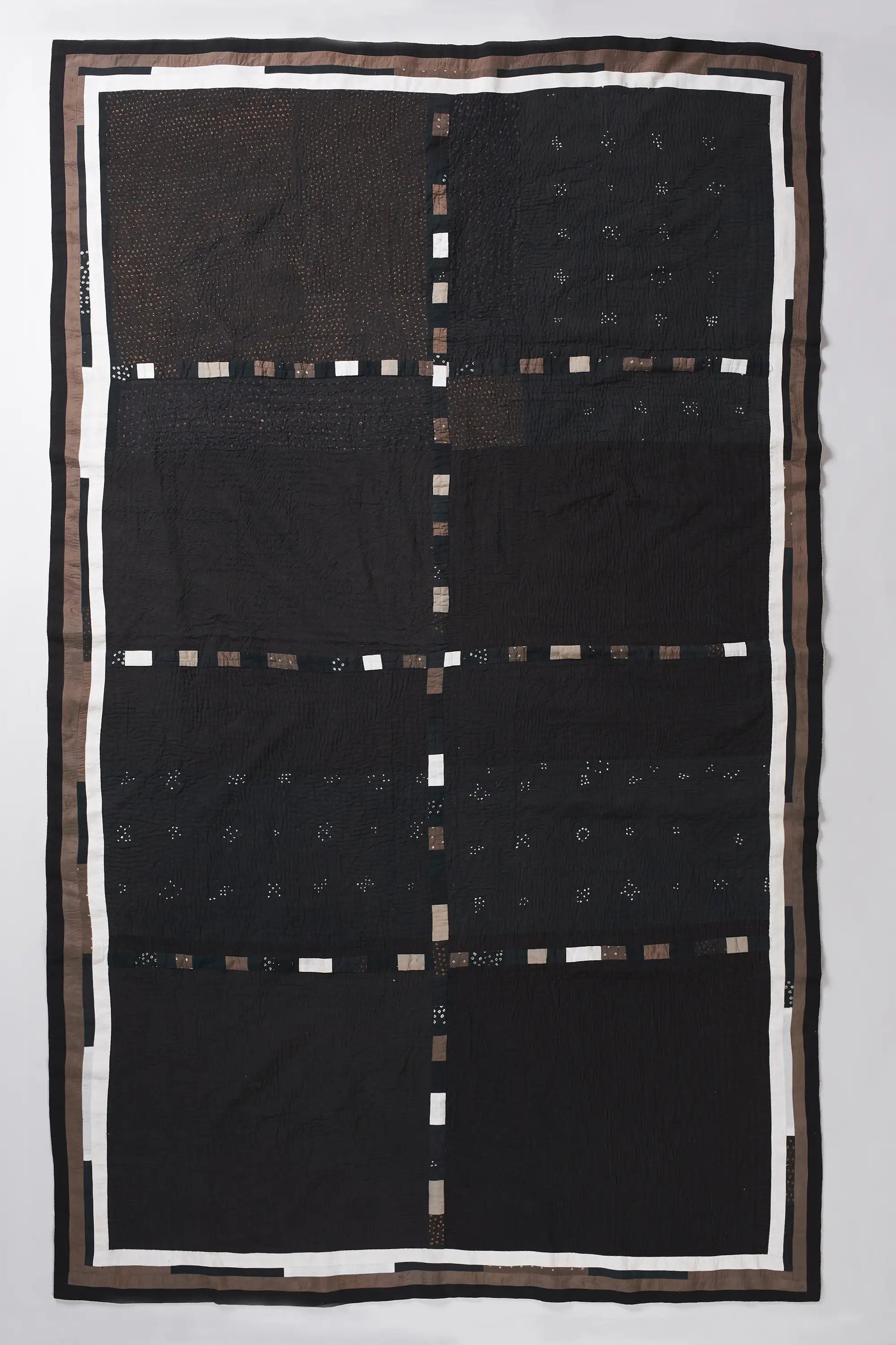 Patchwork quilt in shades of charcoal