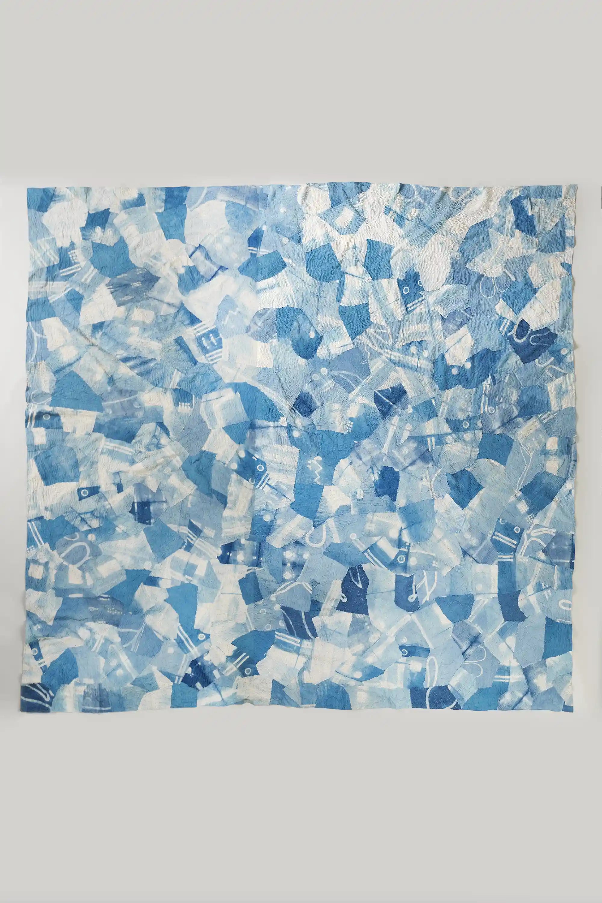 Sky indigo patchwork kantha quilt on light grey background