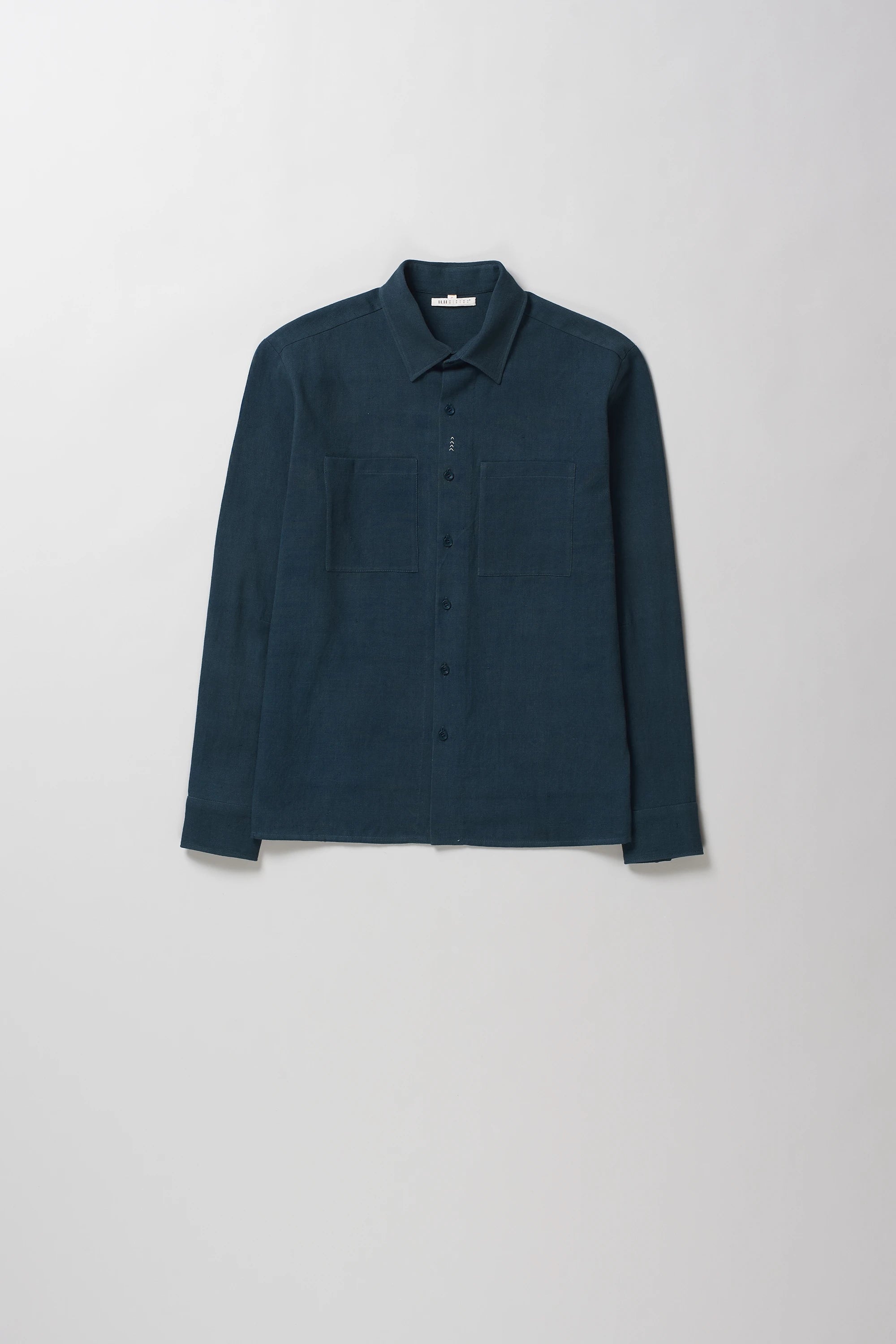 Front image of black indigo cotton shirt with pocket