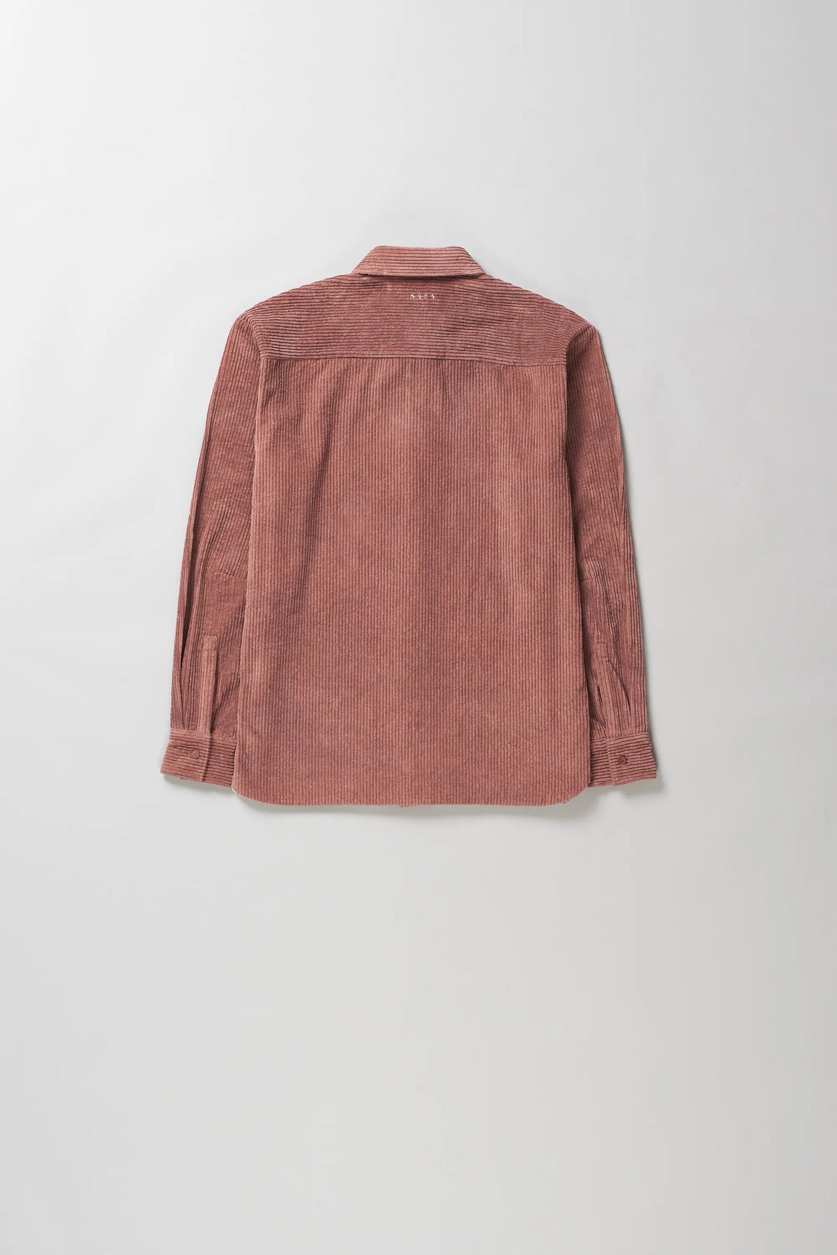 A rough pink corduroy shirt shown from the back, laid flat against a light grey background.