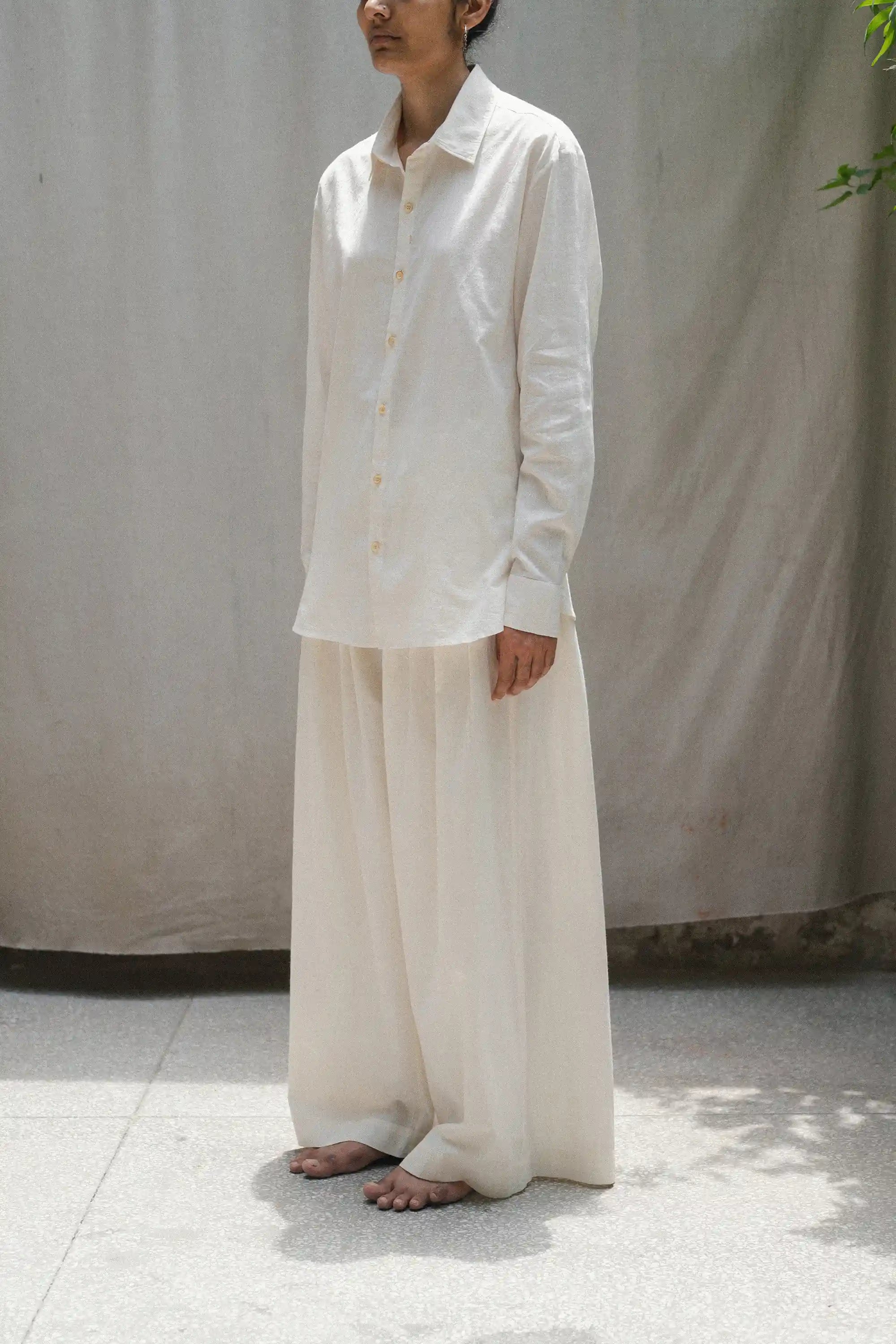 Woman wearing ecru cotton shirt