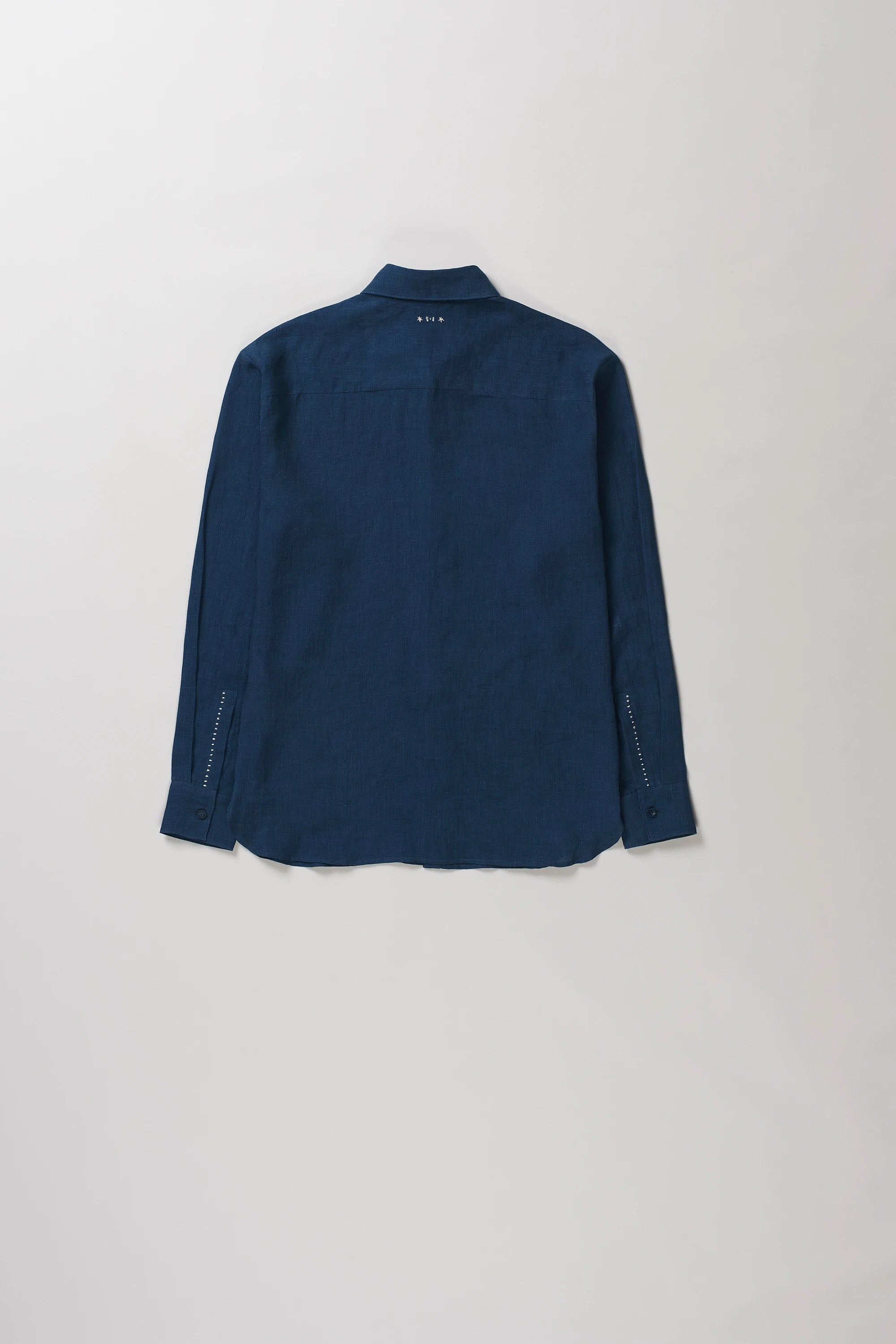 Back image of space blue linen shirt with hand details