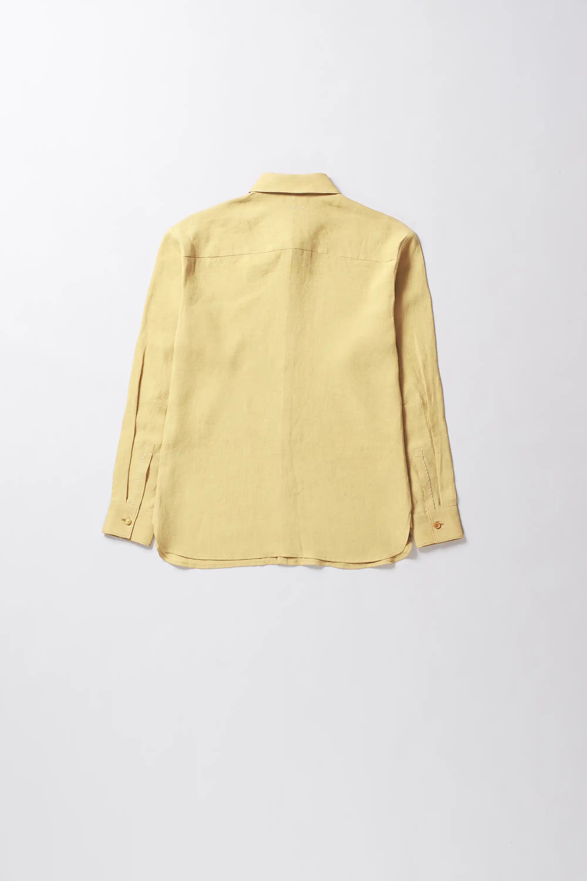 Back shot of brelove linen shirt in yellow