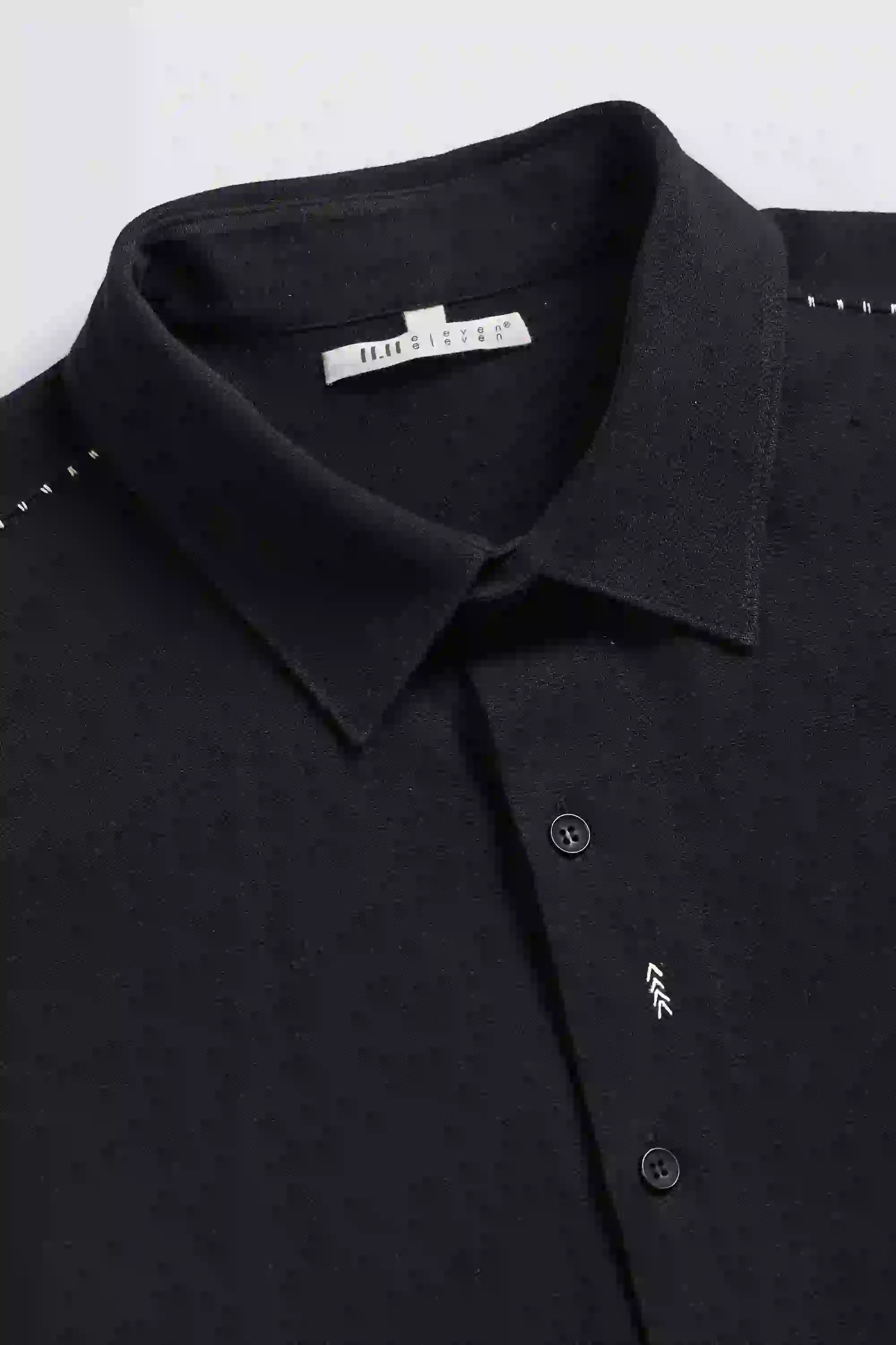 Fabric close-up with buttons and collar