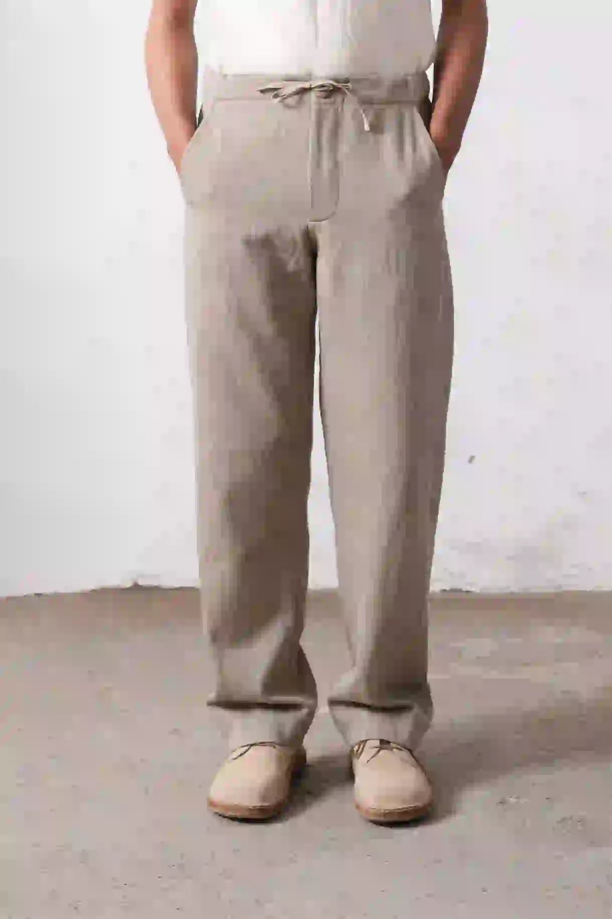 A man wearing ash grey men's trouser