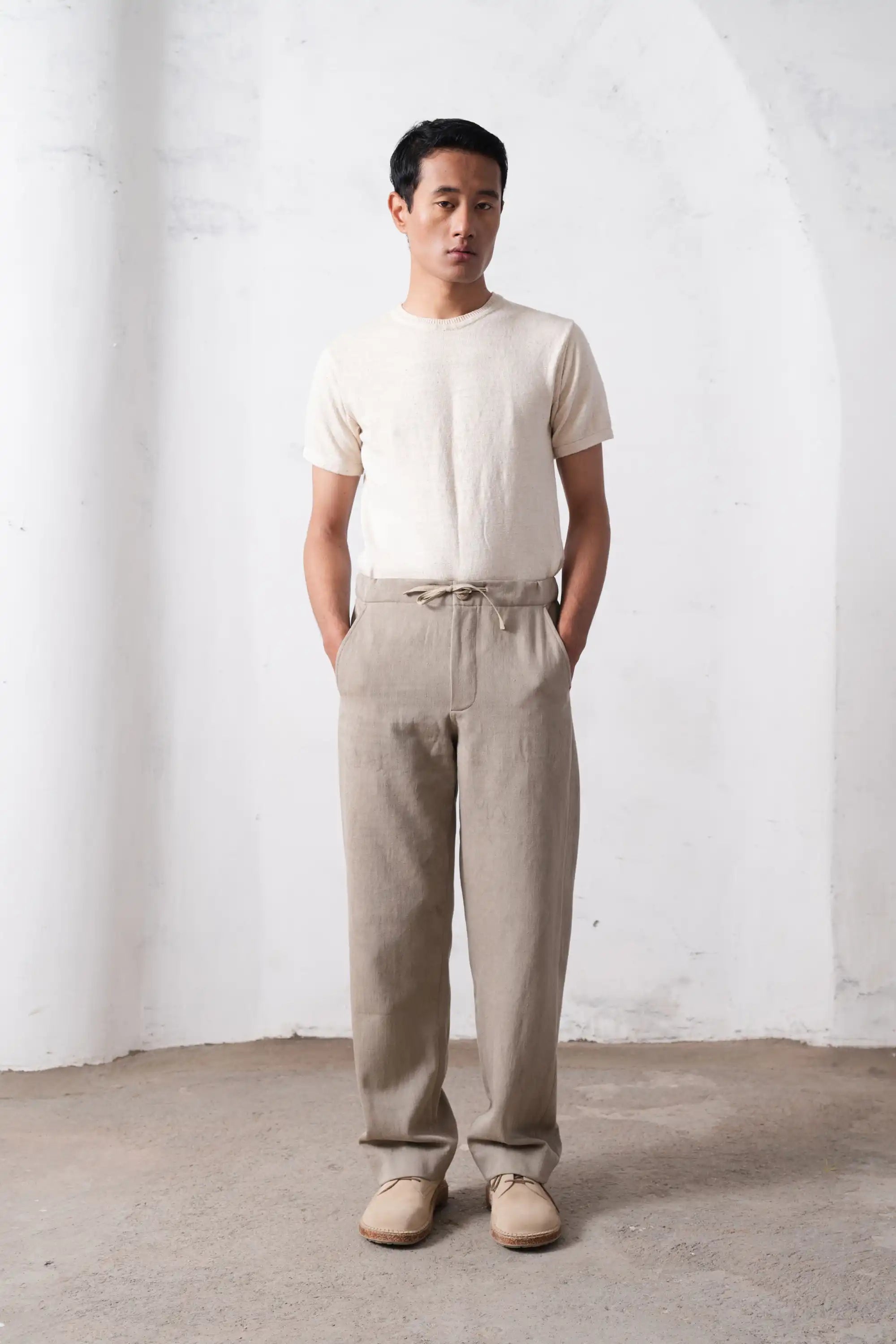 A man wearing ash grey men's trouser